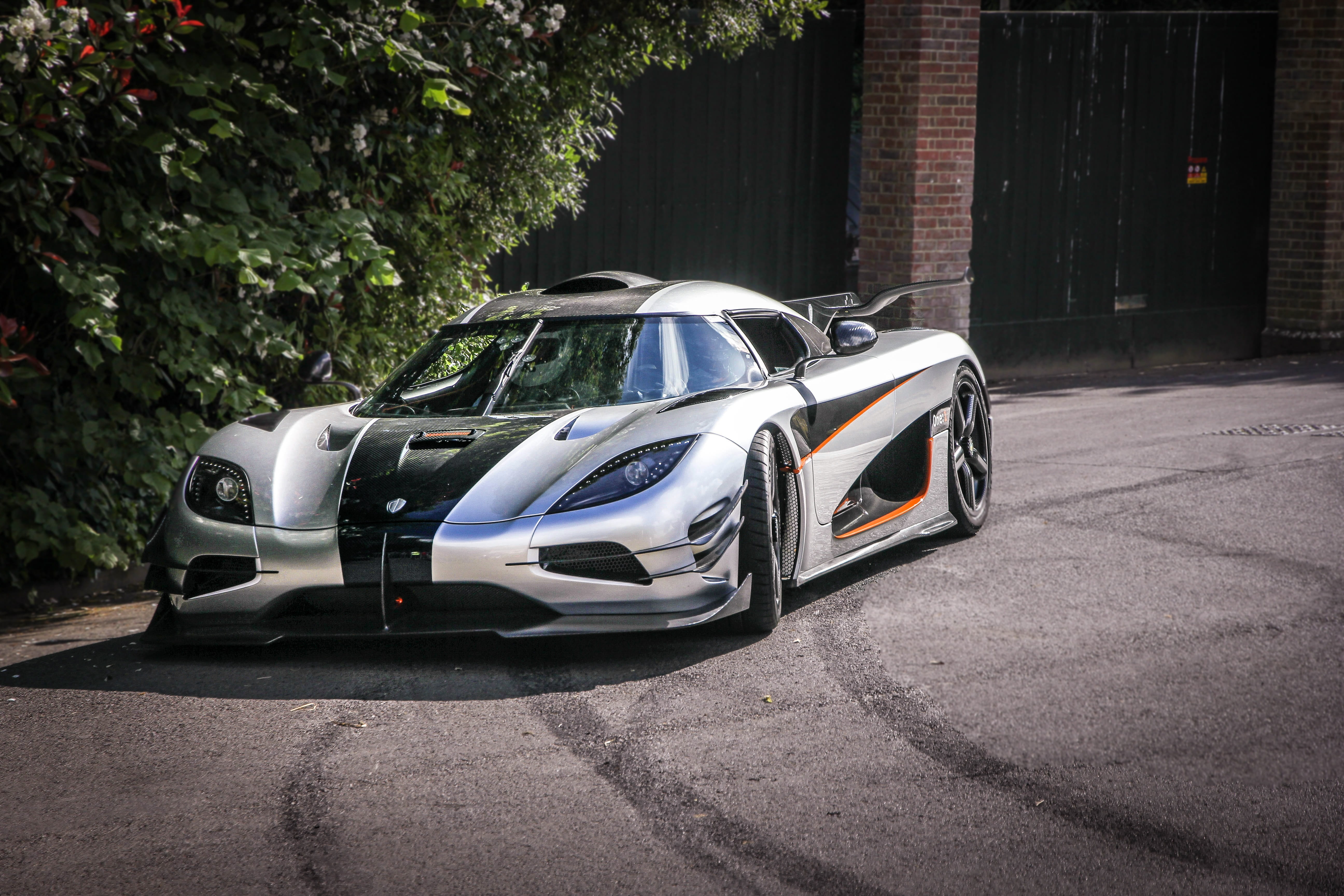 photography, luxury, front view, coupe, racing car, 5K, city, daytime, modern, built structure, day, building exterior, chrome, no People, outdoors, stationary, HD Wallpaper