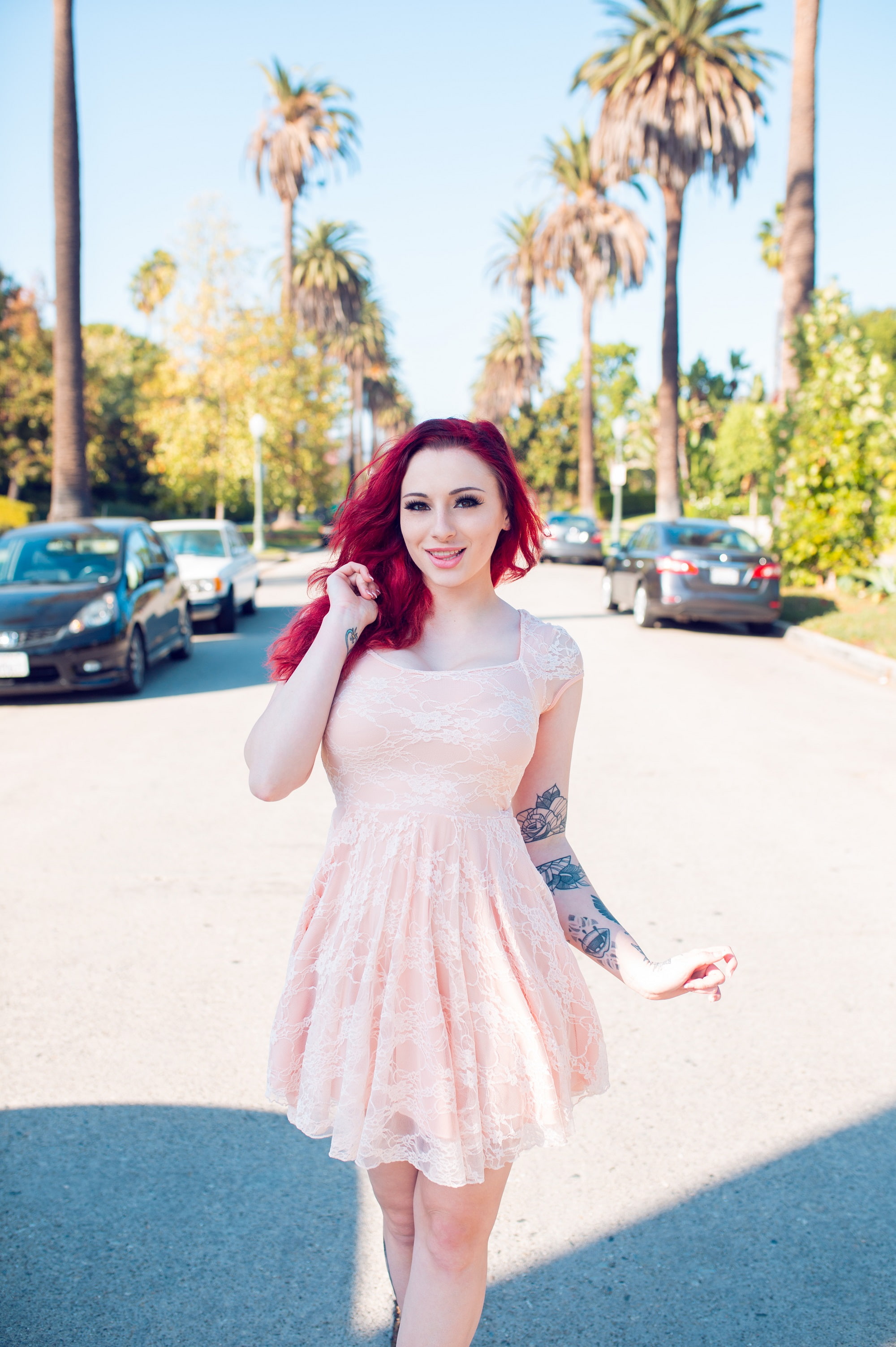inked girls, front view, 2K, redhead, palm trees, adult, hairstyle, young adult, dyed hair, perspective, city, smiling, street, women, beautiful woman, Phone HD Wallpaper