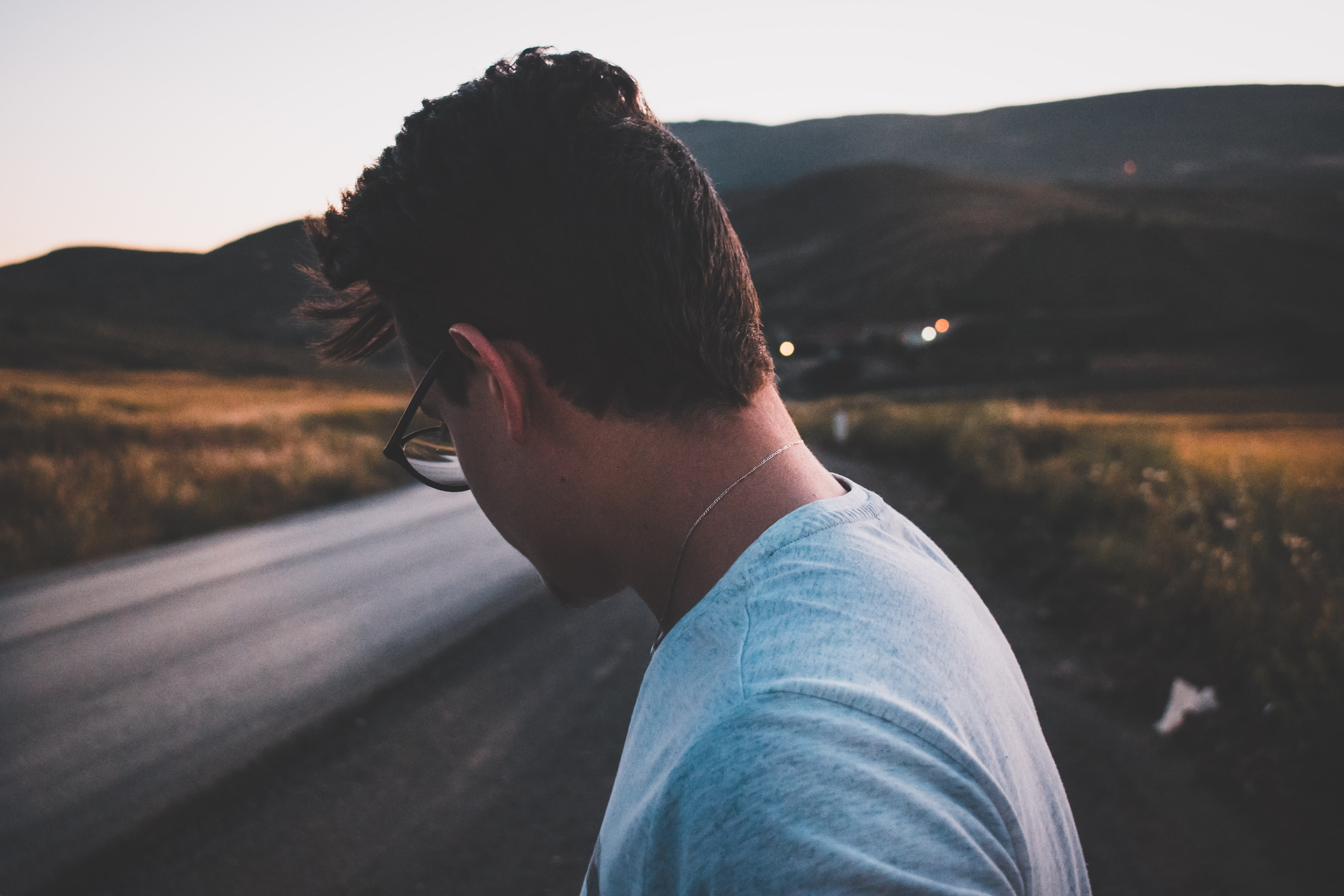 shallow, roadside, portrait, roadtrip, nature, person, photography, glasses, from behind, real people, headshot, standing, men, brunette, asphalt, one person, HD Wallpaper
