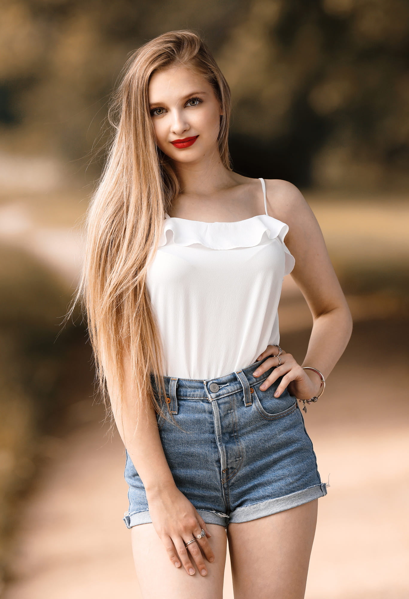 bare shoulders, red lipstick, blurred, long hair, high waisted short, straight hair, women outdoors, white tops, portrait display, blonde, 1080P, depth of field, Phone HD Wallpaper