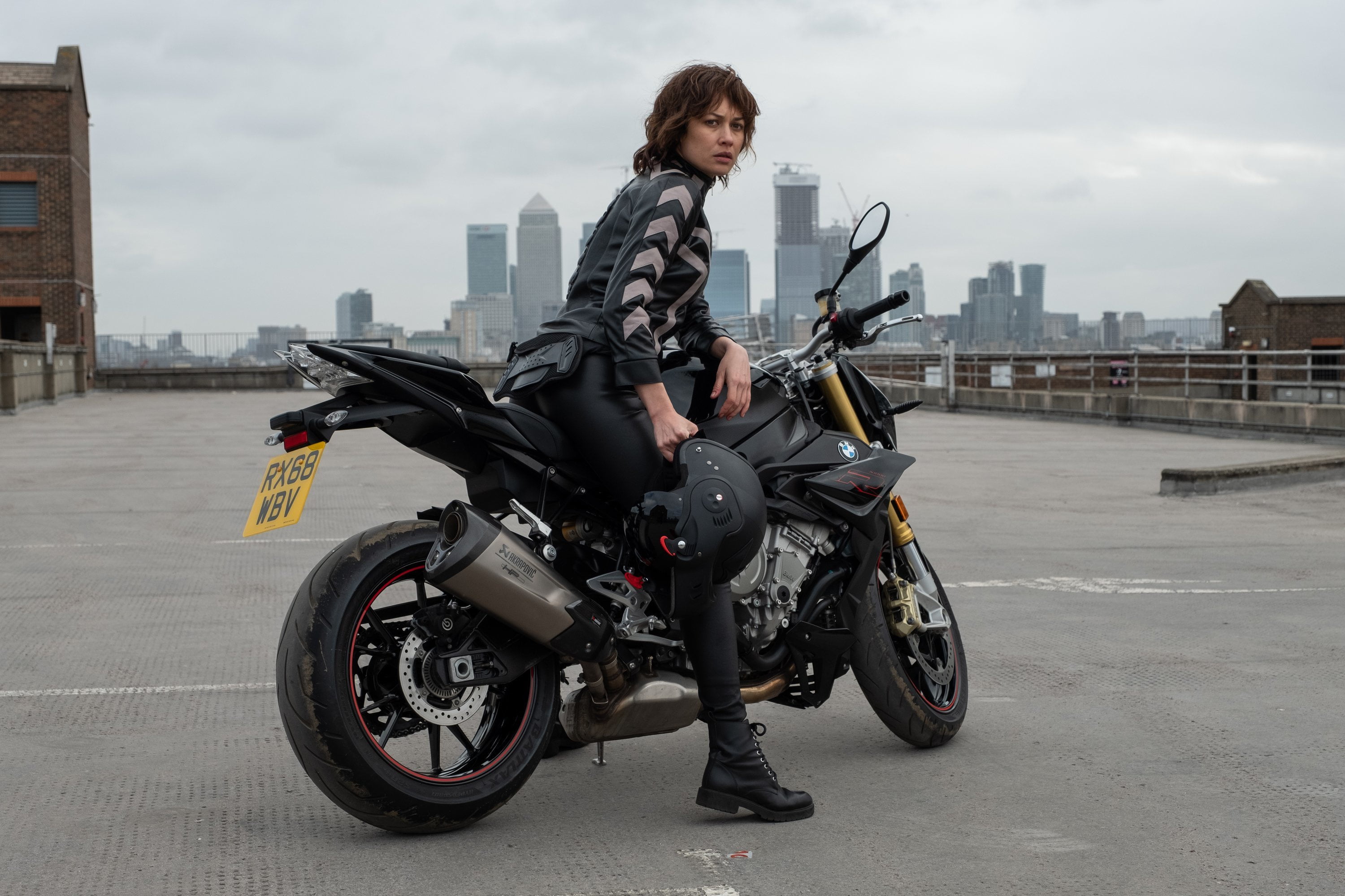 Olga Kurylenko, motorcycle, The Courier, pose, 2K, look, figure, hair, motorcycle helmet in hand, Courier, bike, HD Wallpaper