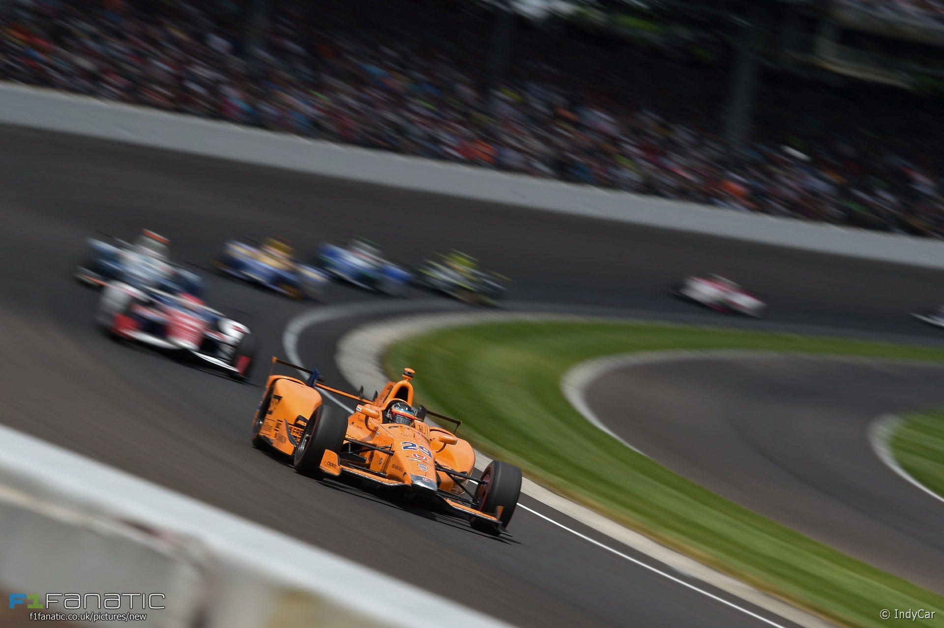 day, speed, motion, auto racing, motor racing track, land vehicle, Fernando Alonso, high angle view, architecture, McLaren, Indy 500, no people, mode of transportation, HD Wallpaper