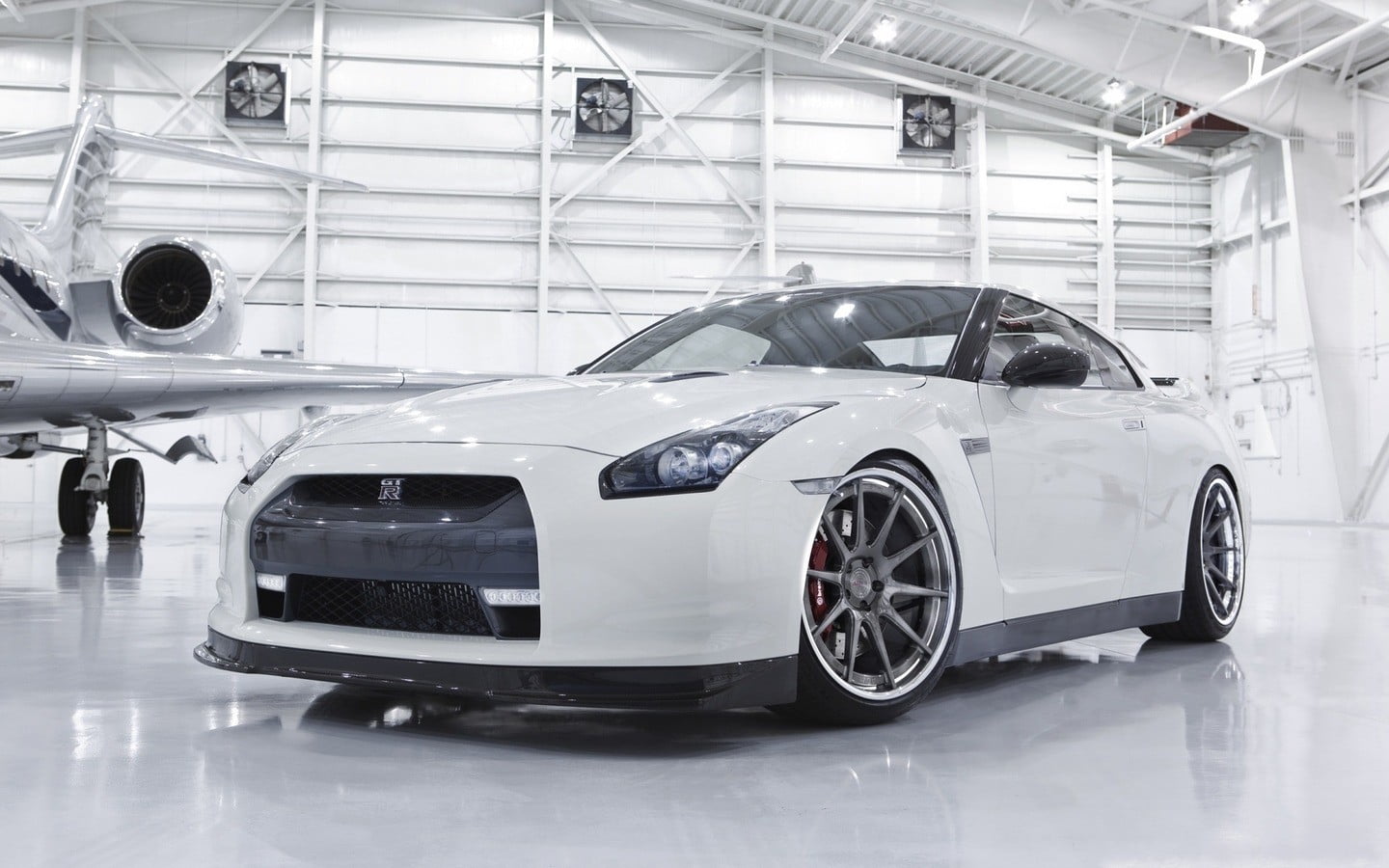 Nissan GTR, nissan, vehicle, land vehicle, day, car, wealth, industry, r, shiny, modern, people, silver colored, white cars, inside, white, transportation, HD Wallpaper