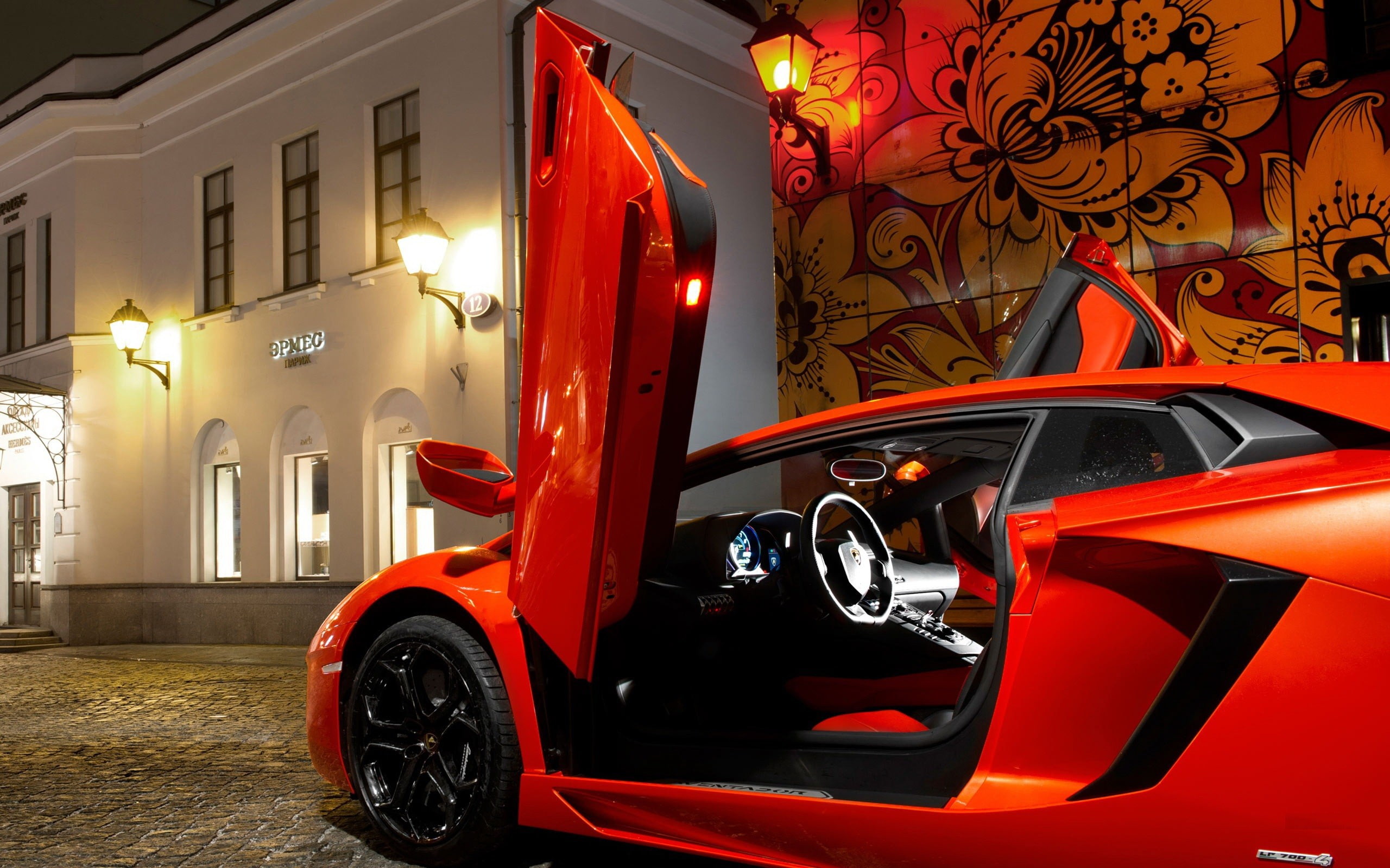 architecture, mode of transportation, Lamborghini, wheel, land vehicle, no people, 2K, outdoors, building exterior, city, illuminated, night, transportation, HD Wallpaper