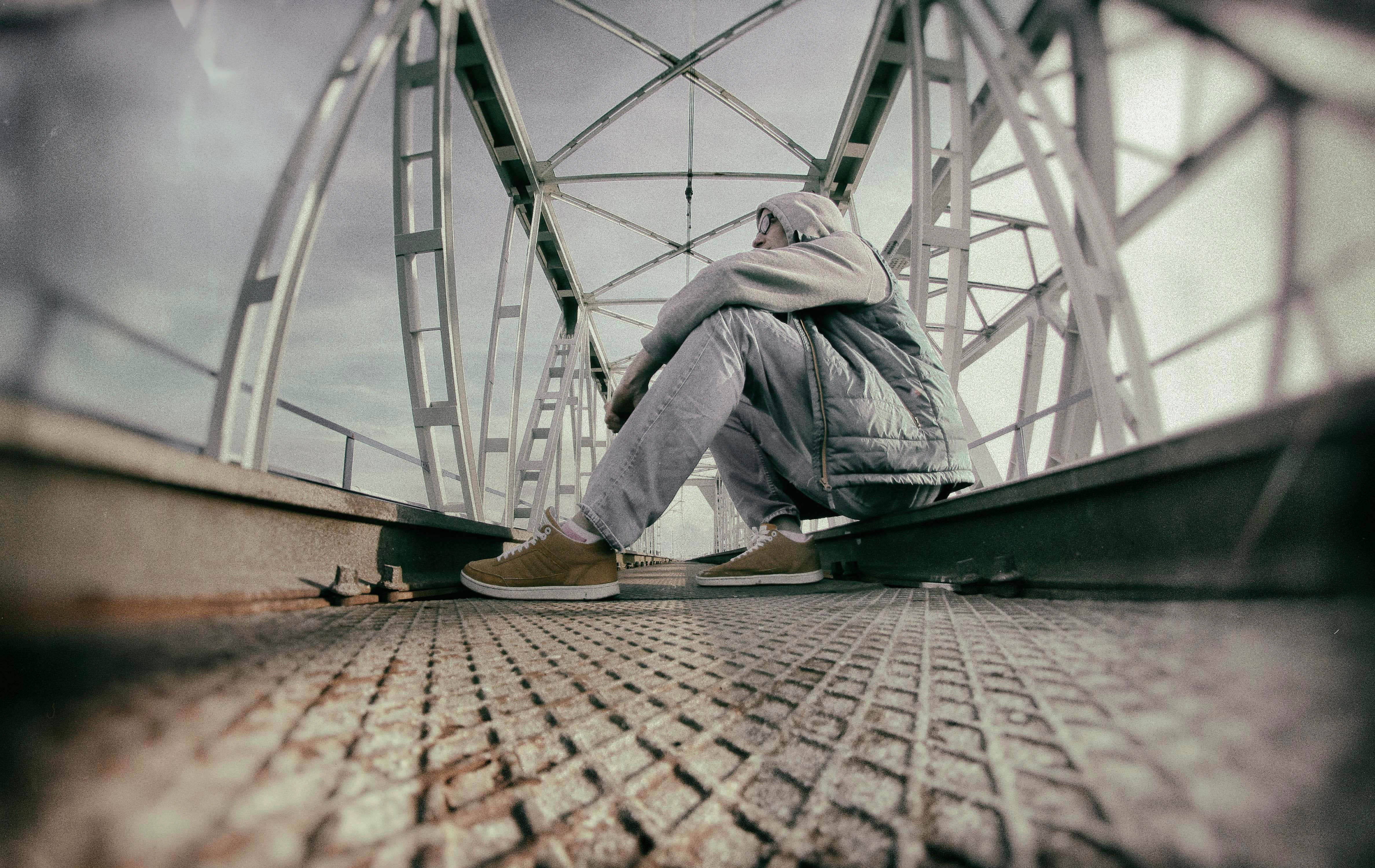 position, anxiety, mood, low section, character, lifestyles, full length, railing, real people, view, built structure, contemplation, gray, travel, paving stone, HD Wallpaper