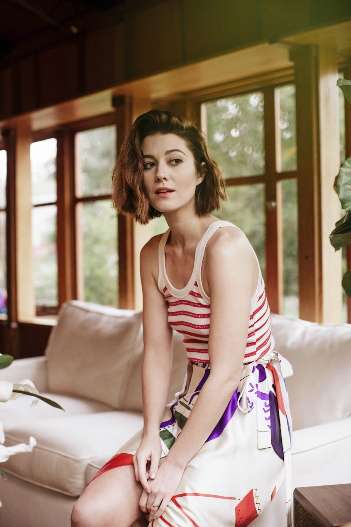 beautiful woman, brunette, couch, fashion, domestic room, contemplation, 720P, one person, luxury, Mary Elizabeth Winstead, hairstyle, bare shoulders, Phone HD Wallpaper