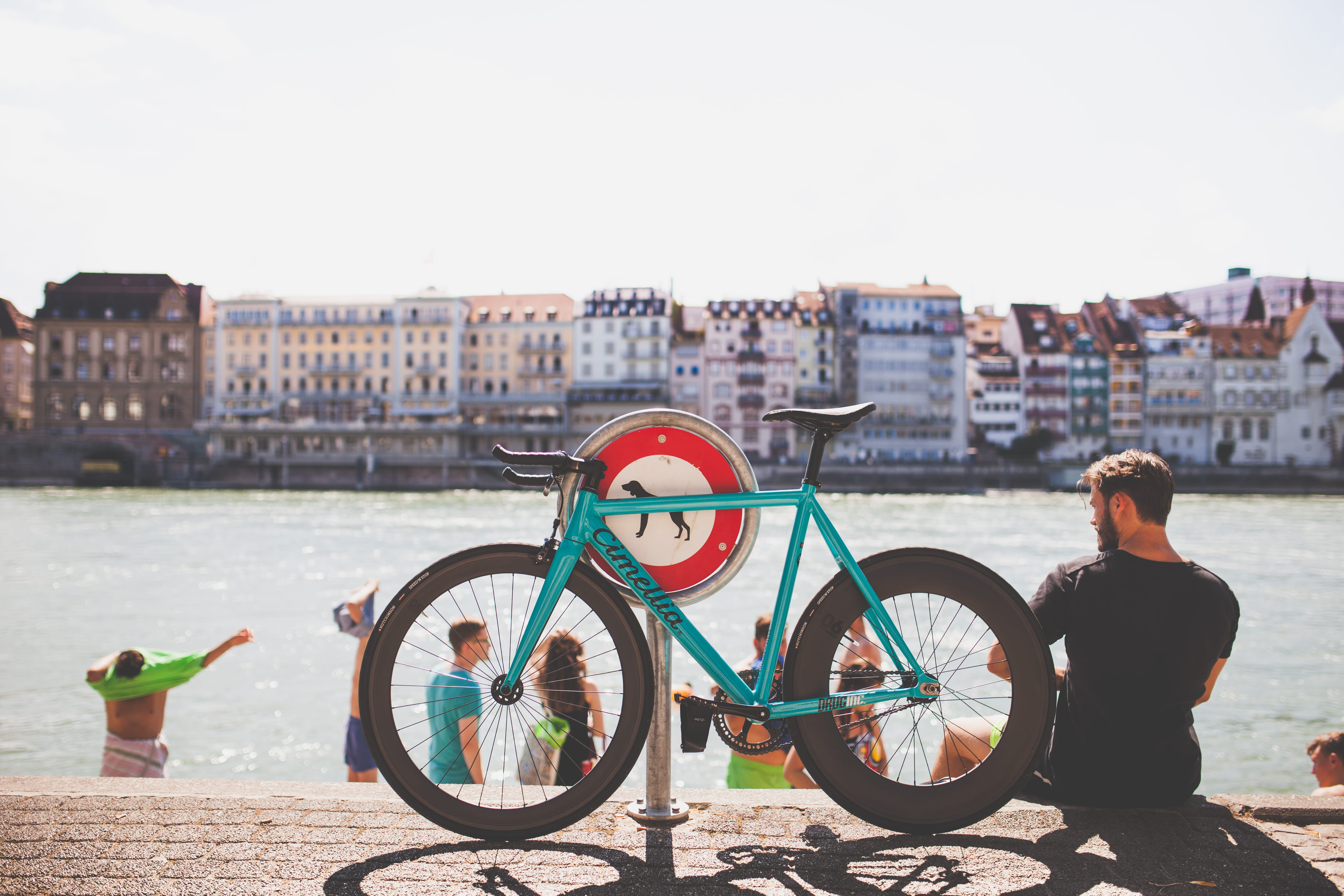 5K, building exterior, man, road, parking, one person, riverside, copy space, river, blue, near, day, outdoors, bike, beside, wheel, bicycle, transportation, HD Wallpaper