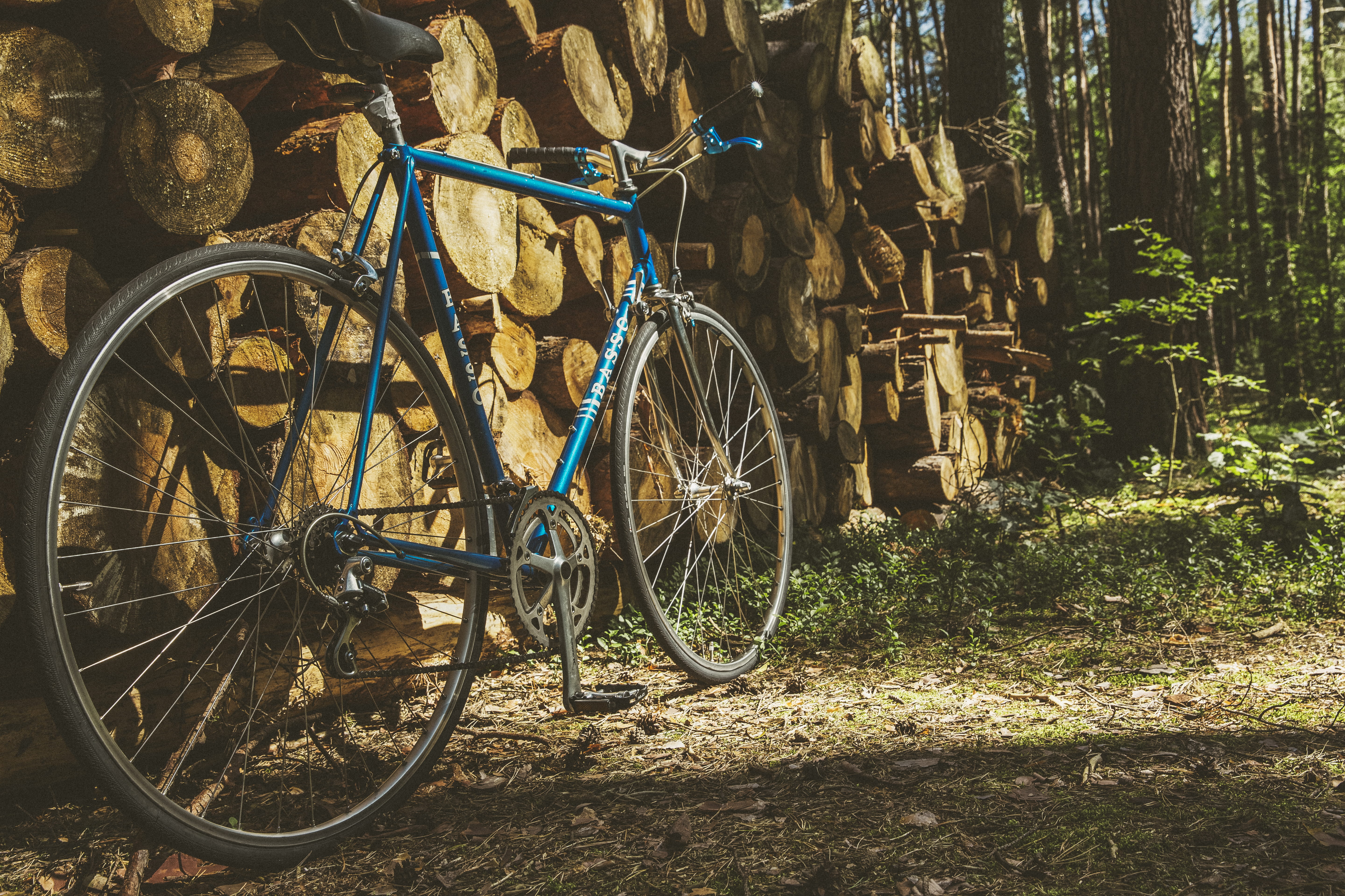 wheels, land vehicle, transportation, shadow, blue, design, urban, 5K, stationary, brakes, steel, frame, no people, trees, daylight, wood, pile, nature, HD Wallpaper