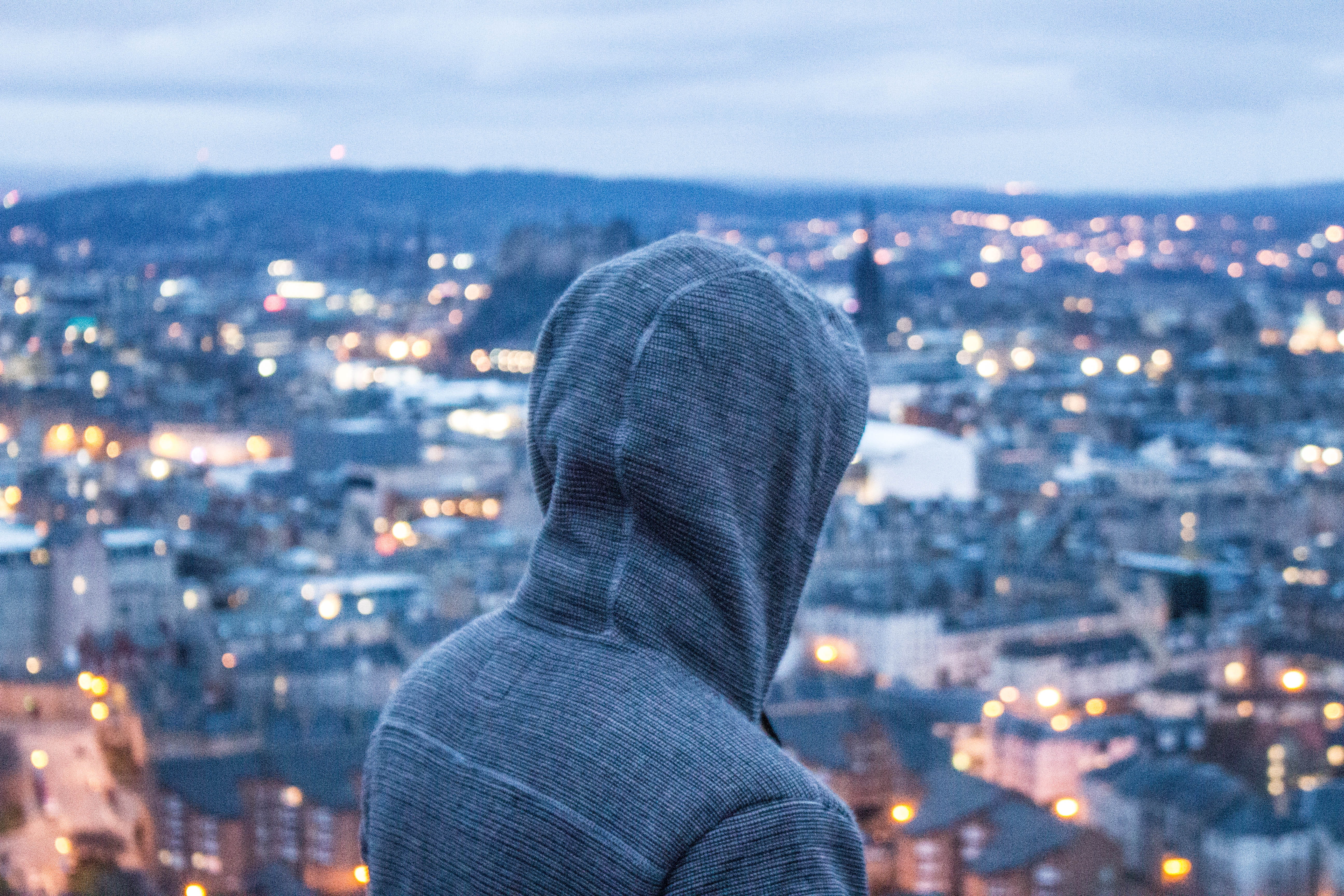 office building exterior, person, hood - clothing, landscape, portrait, built structure, looking at view, people, gray, light, city life, human body part, HD Wallpaper