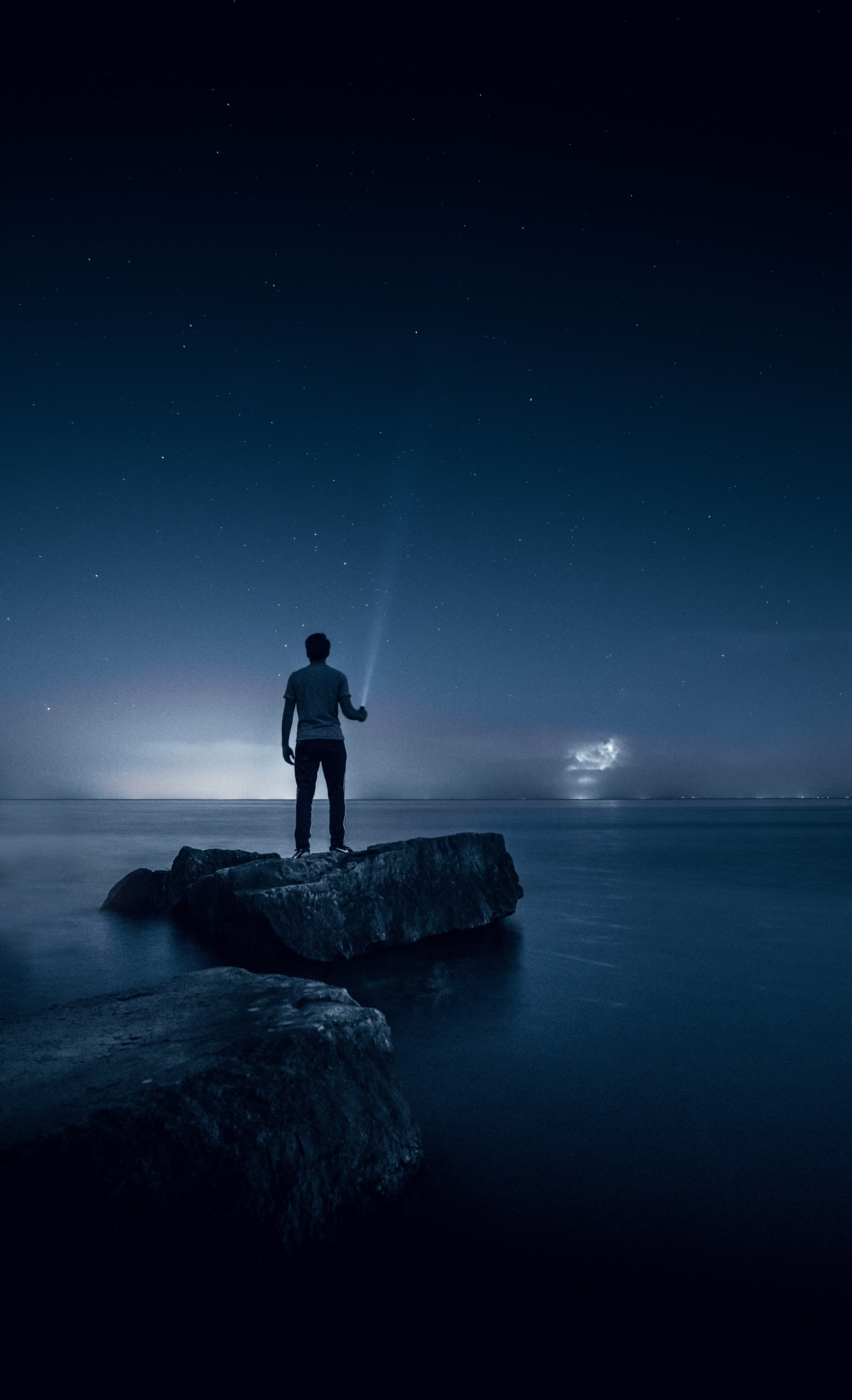 outdoors, 5K, rock, nature, one person, tranquility, sky, starry sky, lake, contemplation, night, rock - object, mississauga, man, water, dark, sea, looking at view, Phone HD Wallpaper