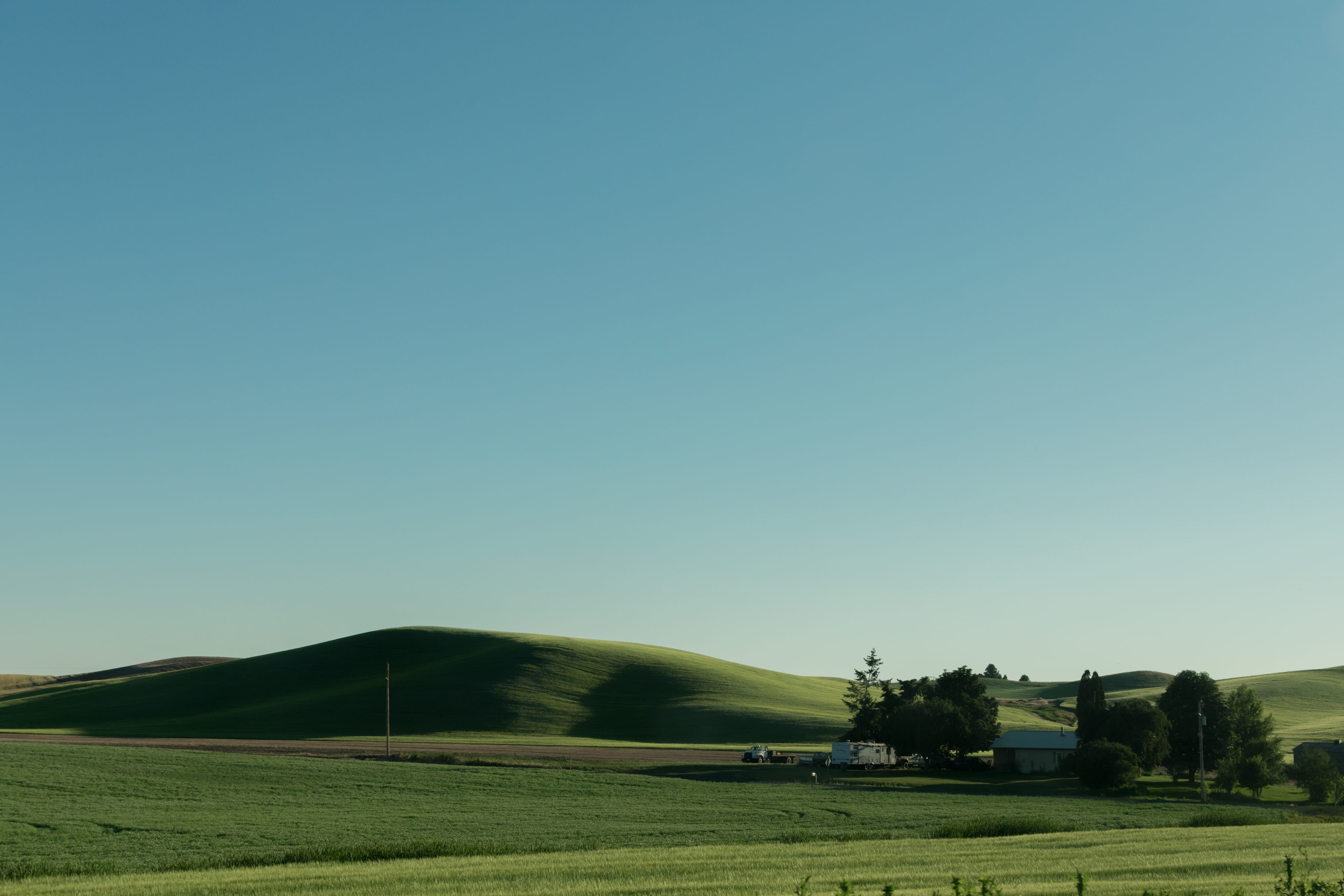 meadow, sky, grass, washington, land, trailer, house, farm, hill, green, middle, environment, sunlight, blue, spokane, beauty in nature, clear sky, day, HD Wallpaper