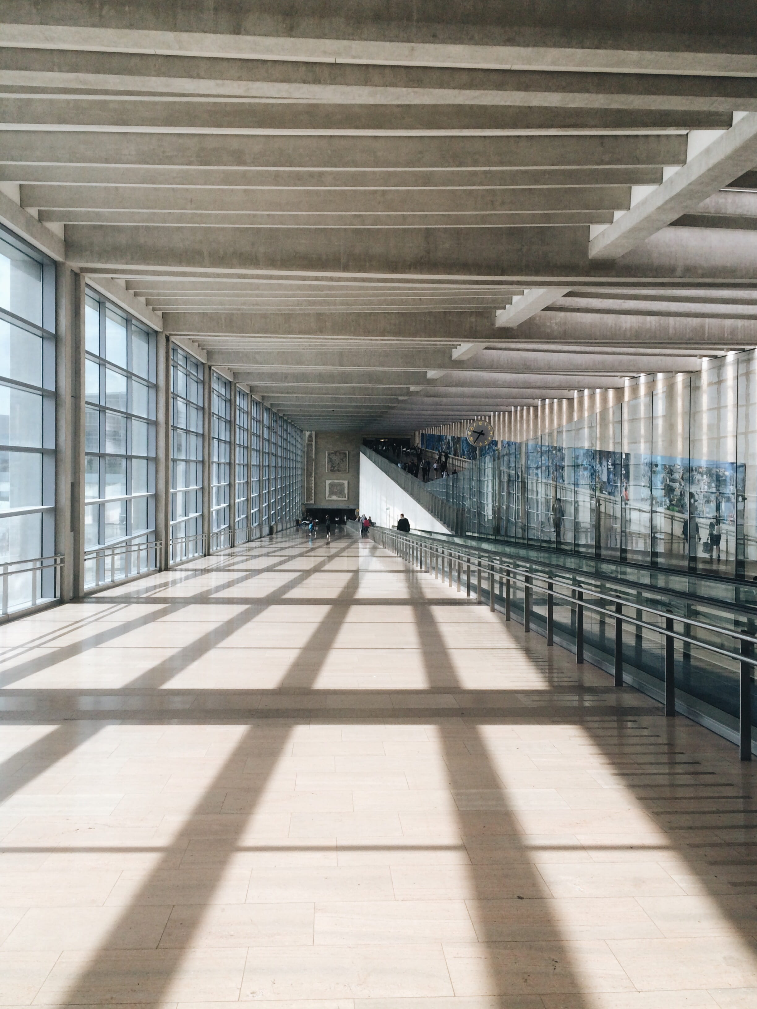 transportation, one person, sun, 2K, empty, symmetry, ben gurion, window, real people, architectural column, bridge, open, airport, sunlight, shadow, tiled floor, Phone HD Wallpaper