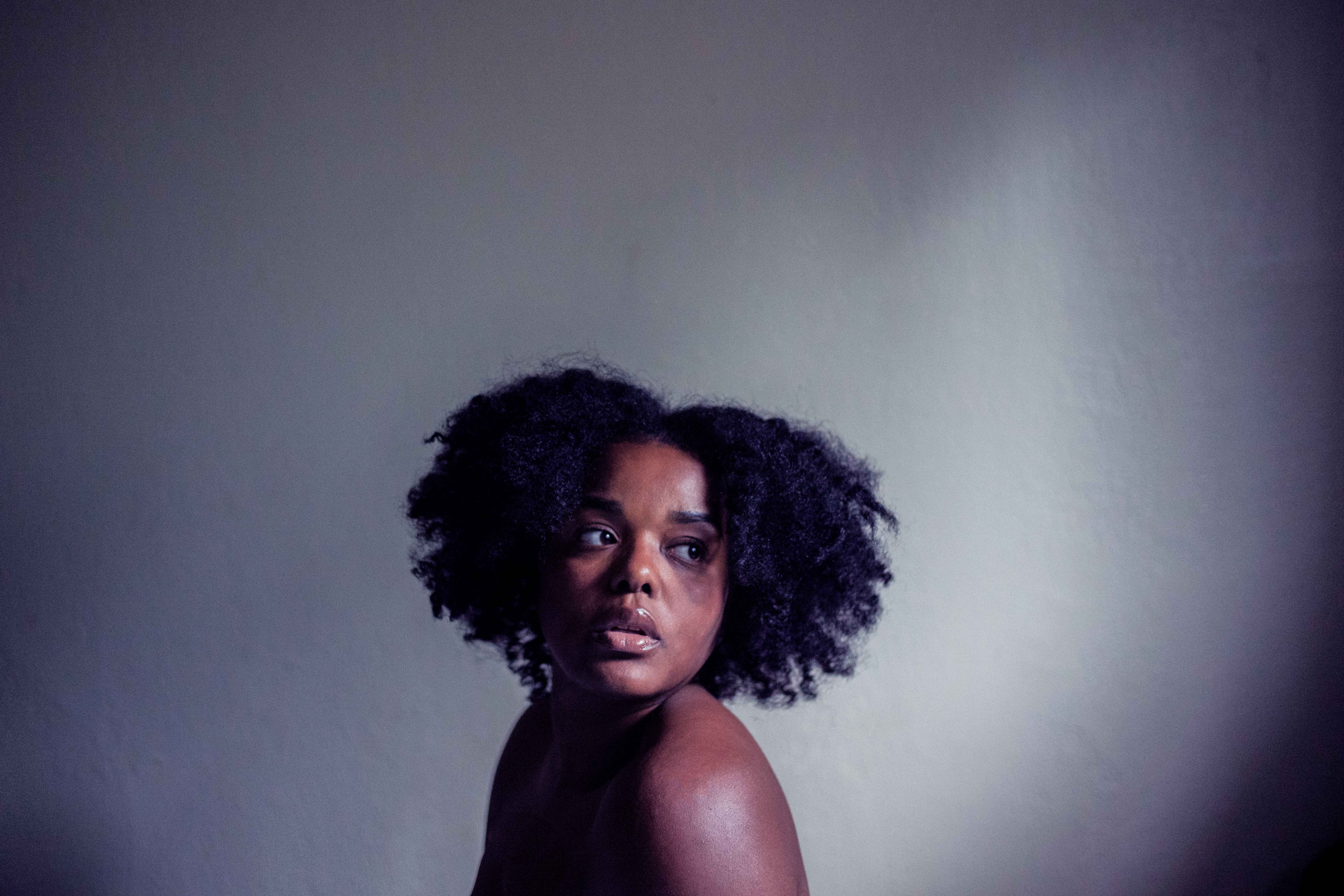 human hair, person, looking at camera, indoors, female, portrait, afro, scared, lonely, sad, headshot, adult, hairstyle, emotion, hair, cold, serious, lady, HD Wallpaper