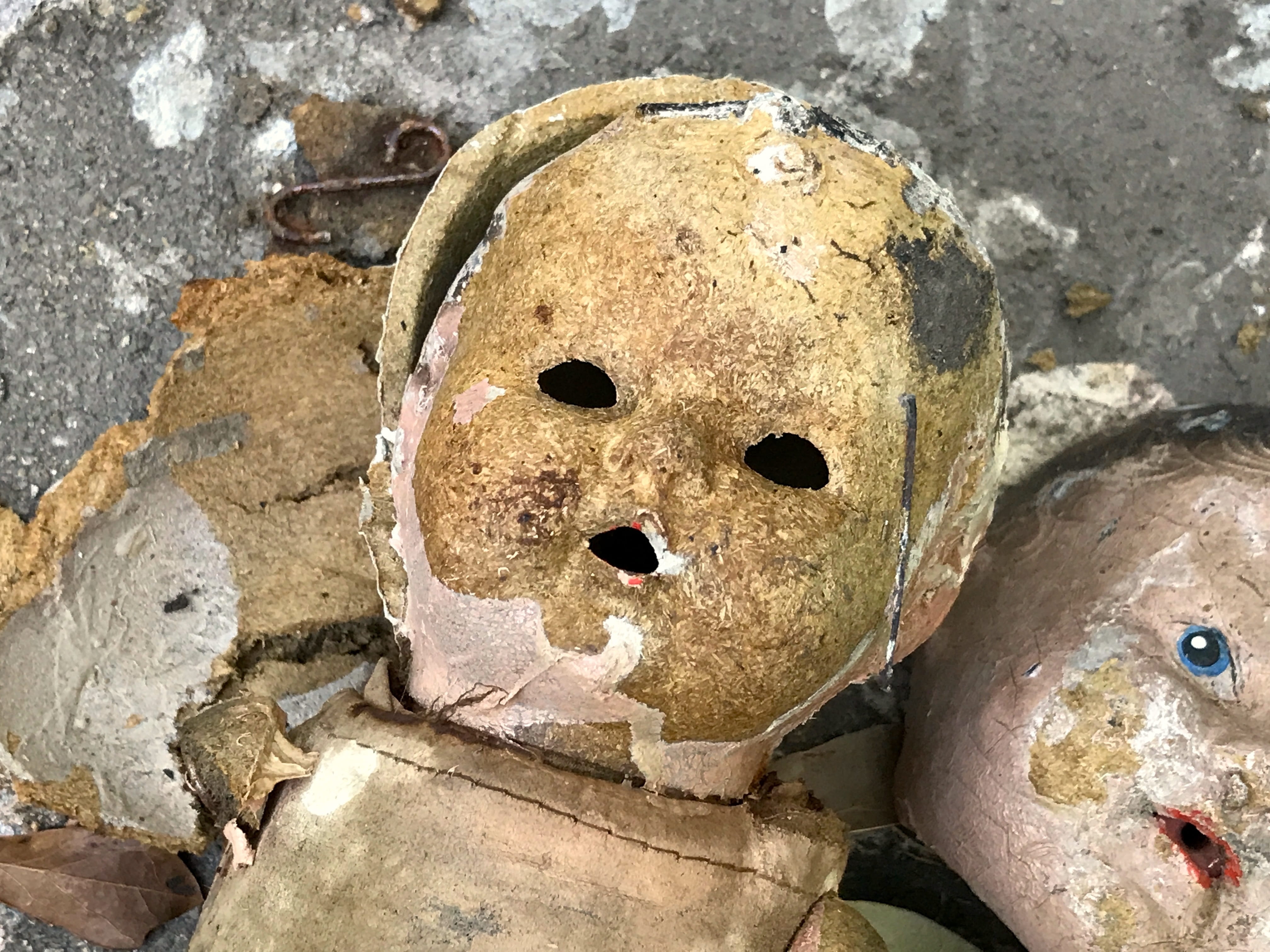 anthropomorphic face, day, rock, doll, scary, face, damaged, rough, rock - object, porcelain, photography, eerie, eyes, focus, 4K, human representation, HD Wallpaper