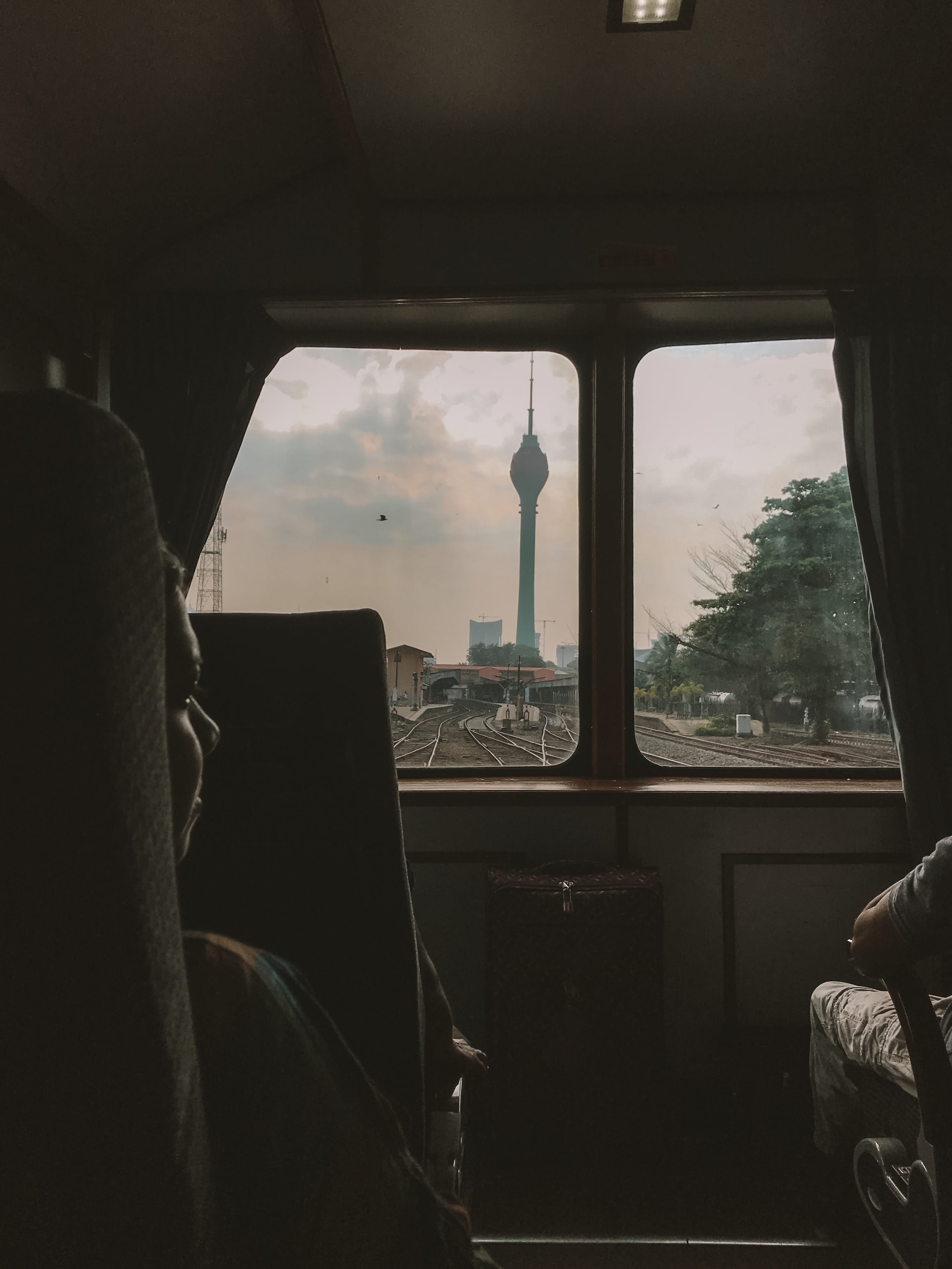 inside, real people, land vehicle, tower, one person, outdoors, seat, train, person, indoors, chair, building, screen, cushion, home decor, window, human, Phone HD Wallpaper