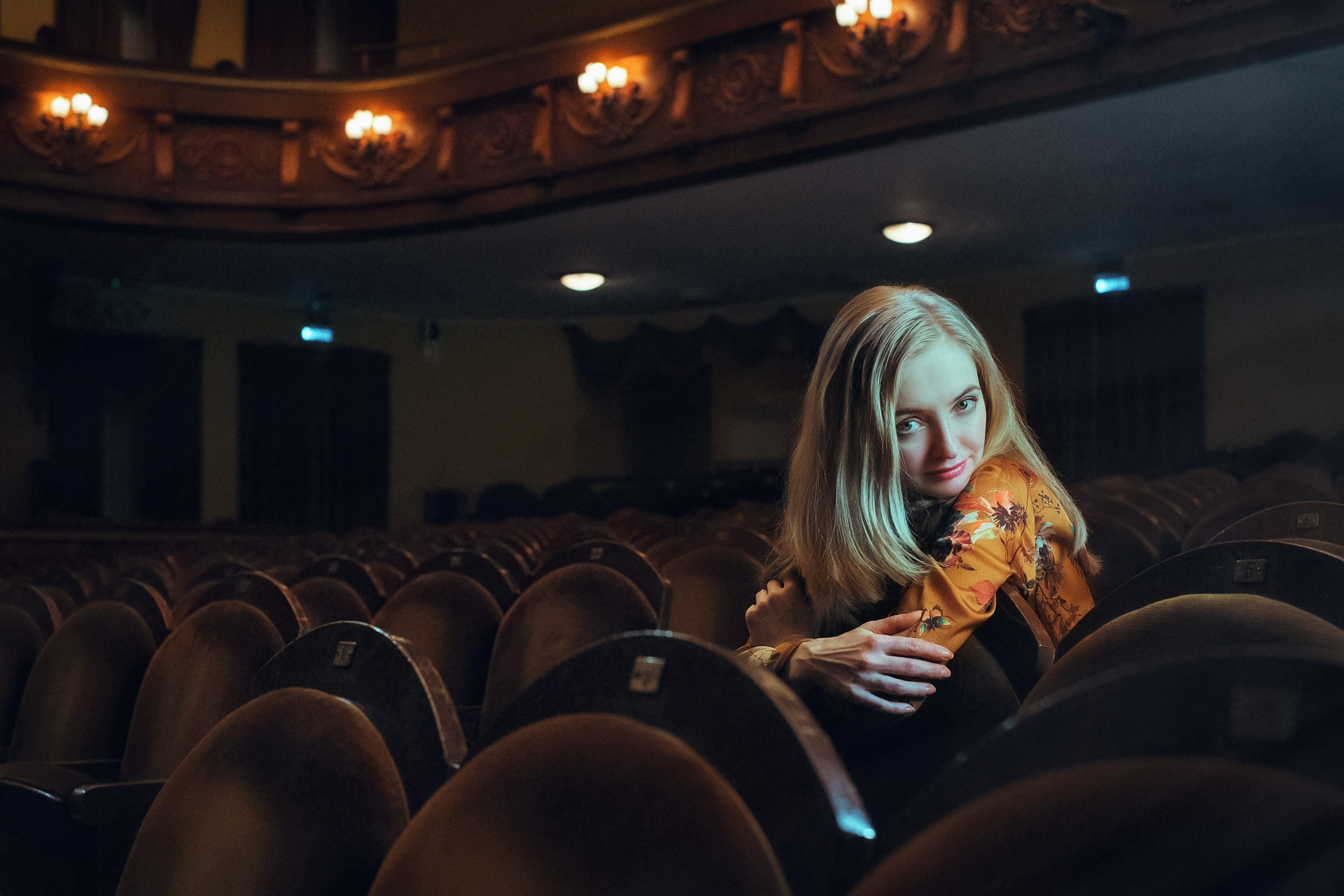 person, movie, leisure activity, photoshoot, sitting, hairstyle, room, museum, chair, holding, amphitheater, adult, beautiful woman, long hair, woman, musician, HD Wallpaper