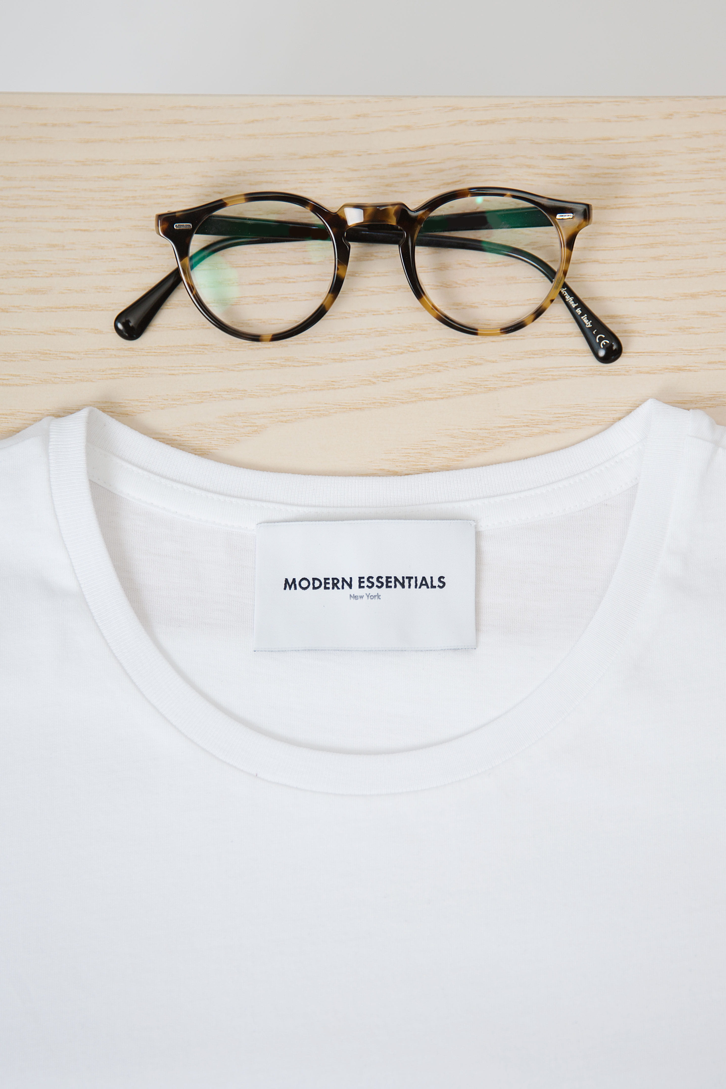 flat lay, shirt, white, modernessential, black, label, cotton, brand, tshirt, close, front View, crew, minimal, slab, elegance, isolated, casual Clothing, Phone HD Wallpaper