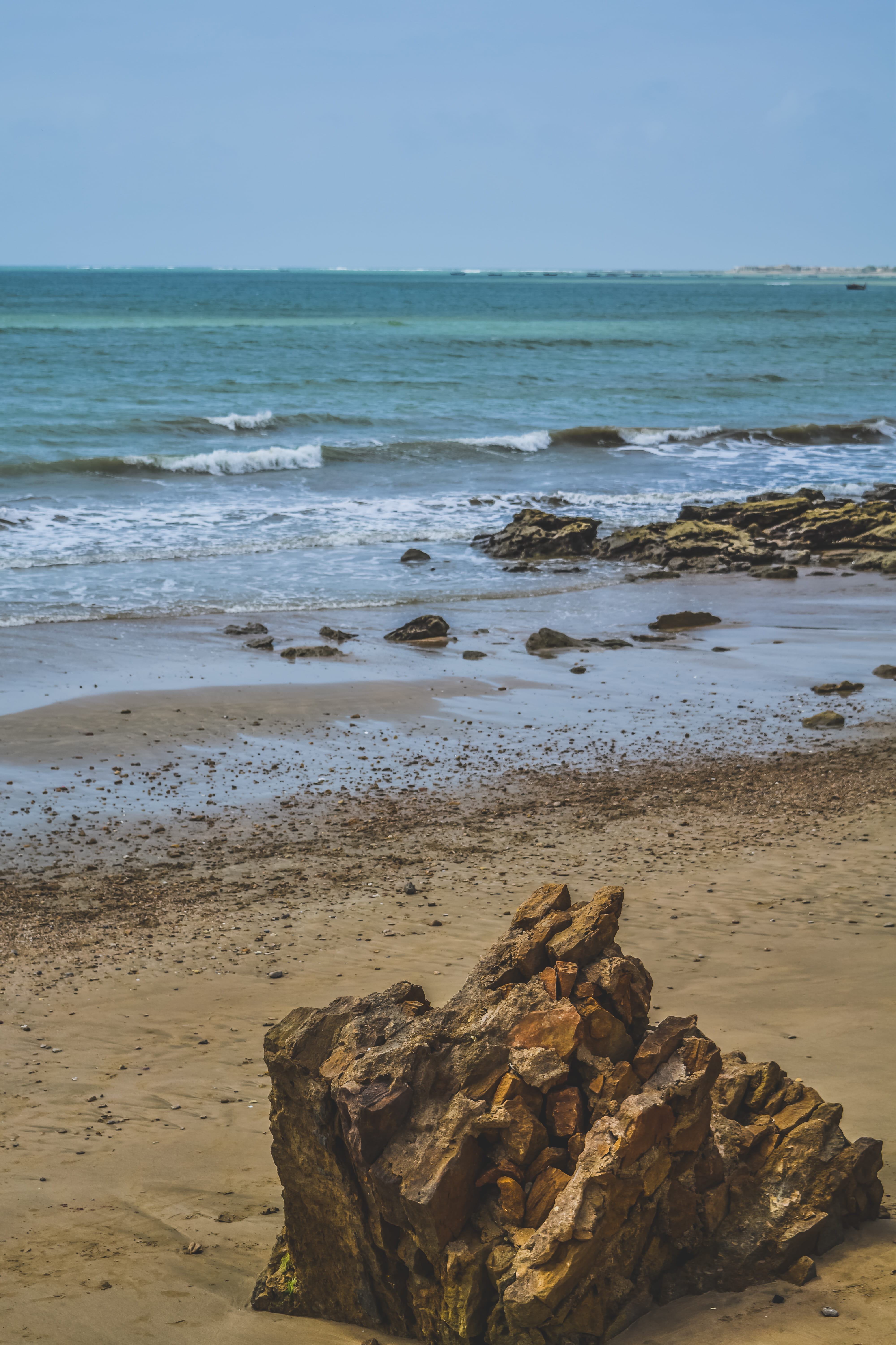 oceanview, beauty in nature, blue, outdoors, pakistan, rock - object, motion, solid, waves, tranquility, ocean, sand, beach, water, horizon, land, nature, Phone HD Wallpaper