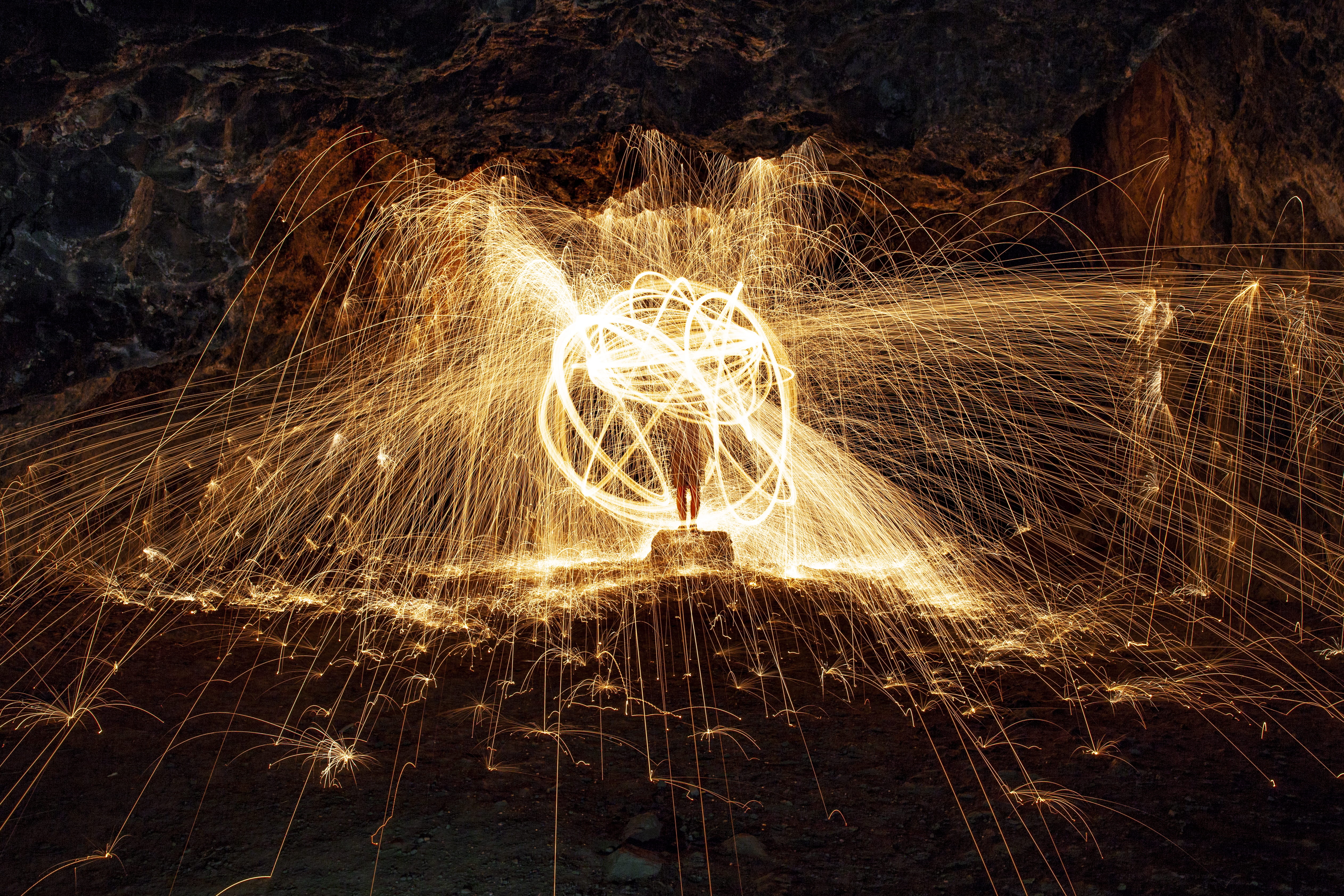 photography, blurred motion, glowing, wool, creativity, outdoors, cave, fire, art, sparkler, steel, motion, one person, firework - man made object, real people, HD Wallpaper