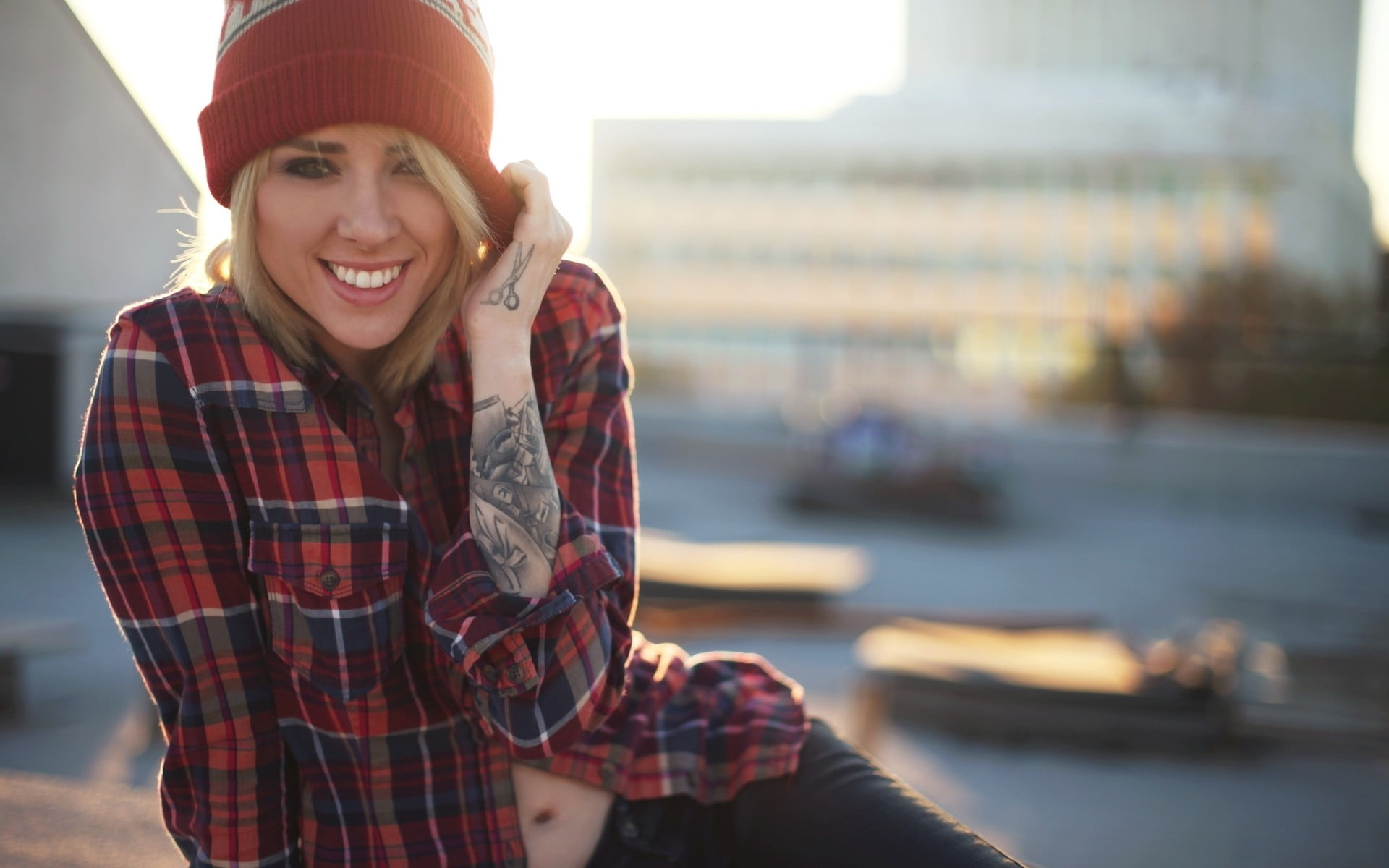 checked pattern, hat, red, smiling, front view, woolly hat, women outdoors, leisure activity, sitting, knit, looking at camera, blonde, casual clothing, HD Wallpaper