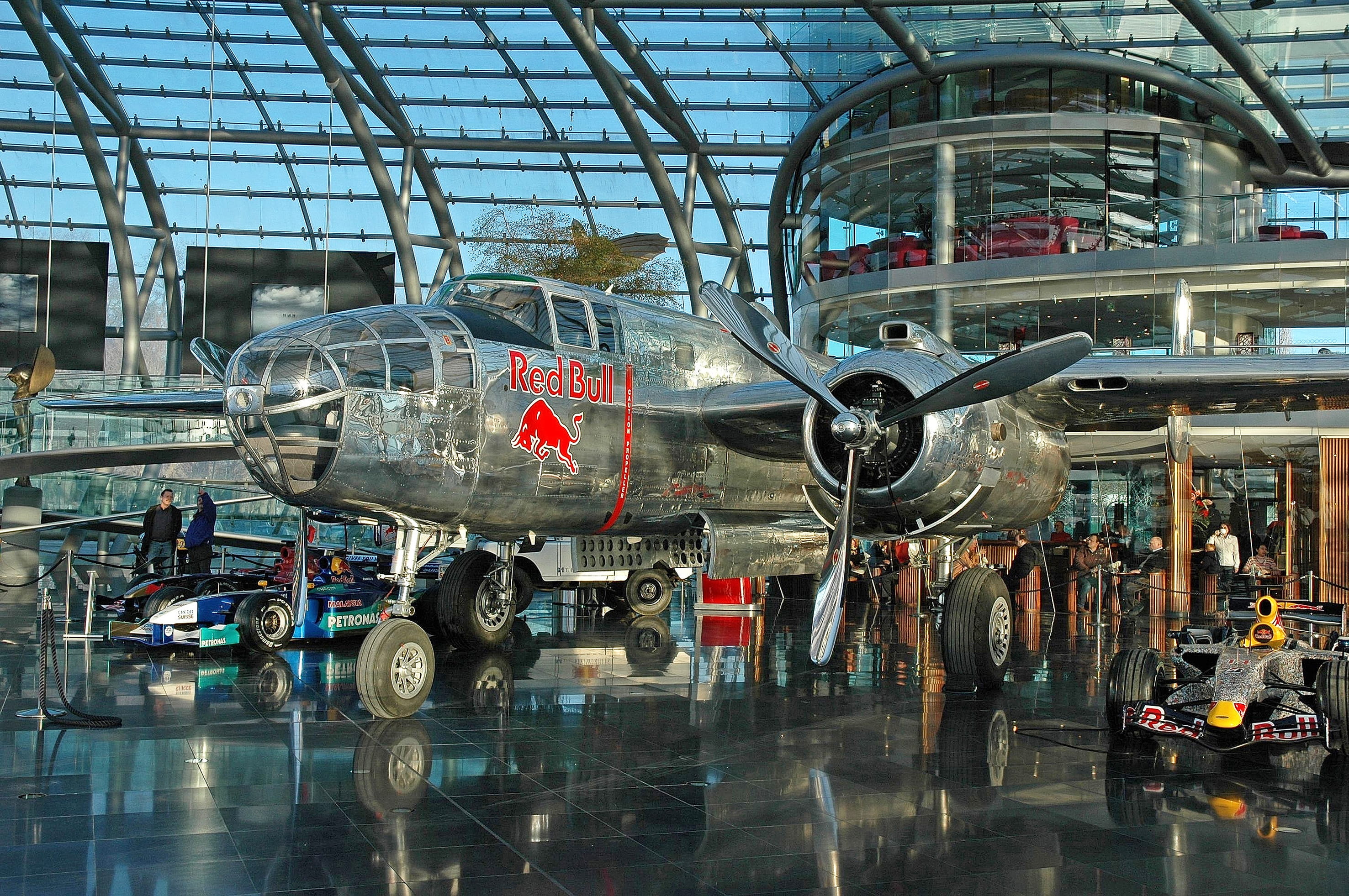 indoors, reflection, town, vehicle, airport, salzburg, urban, airport terminal, red bull hanger 7, travel, hangar, warplane, aircraft, mode of transportation, HD Wallpaper