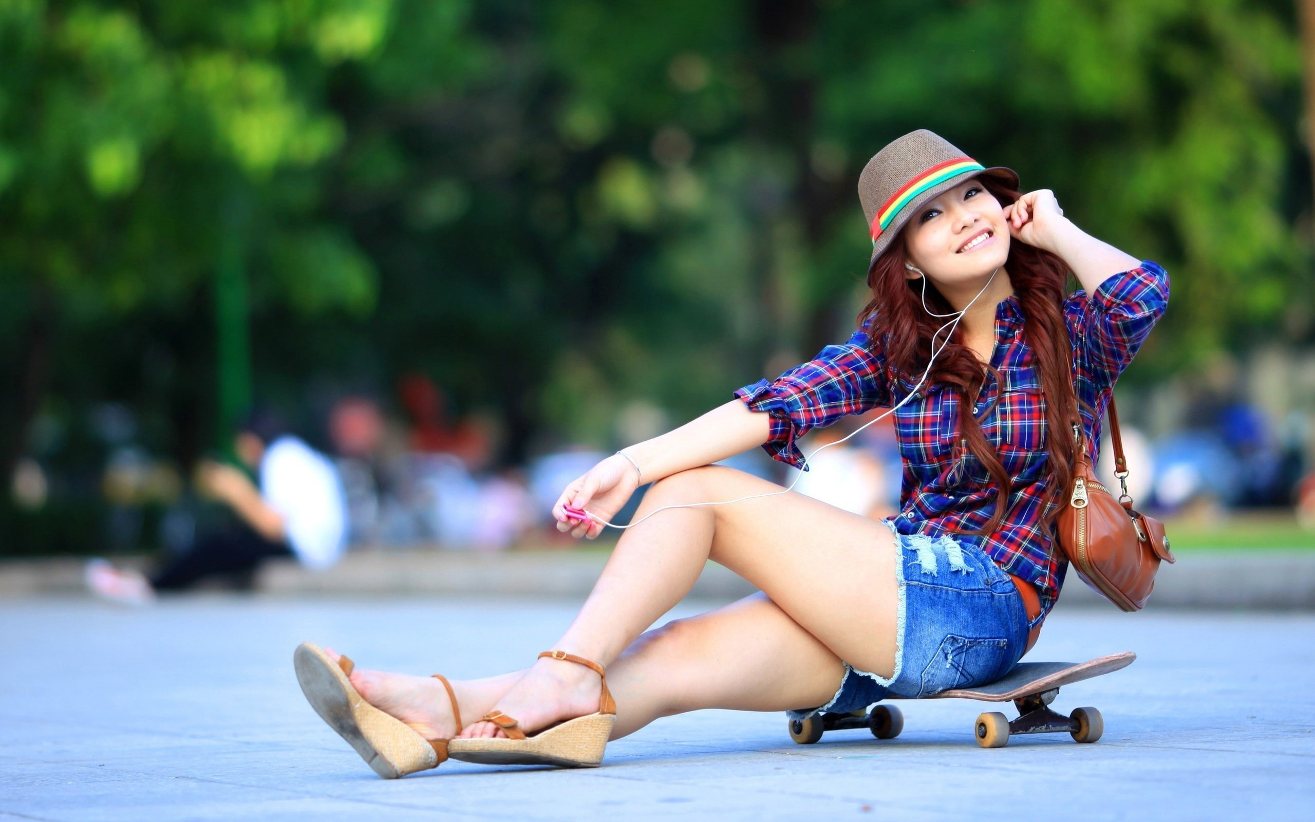 fashion, hat, full length, clothing, day, sitting, lifestyles, women, shirt, skateboard, earphones, 2K, Asian, real people, looking at viewer, smiling, HD Wallpaper