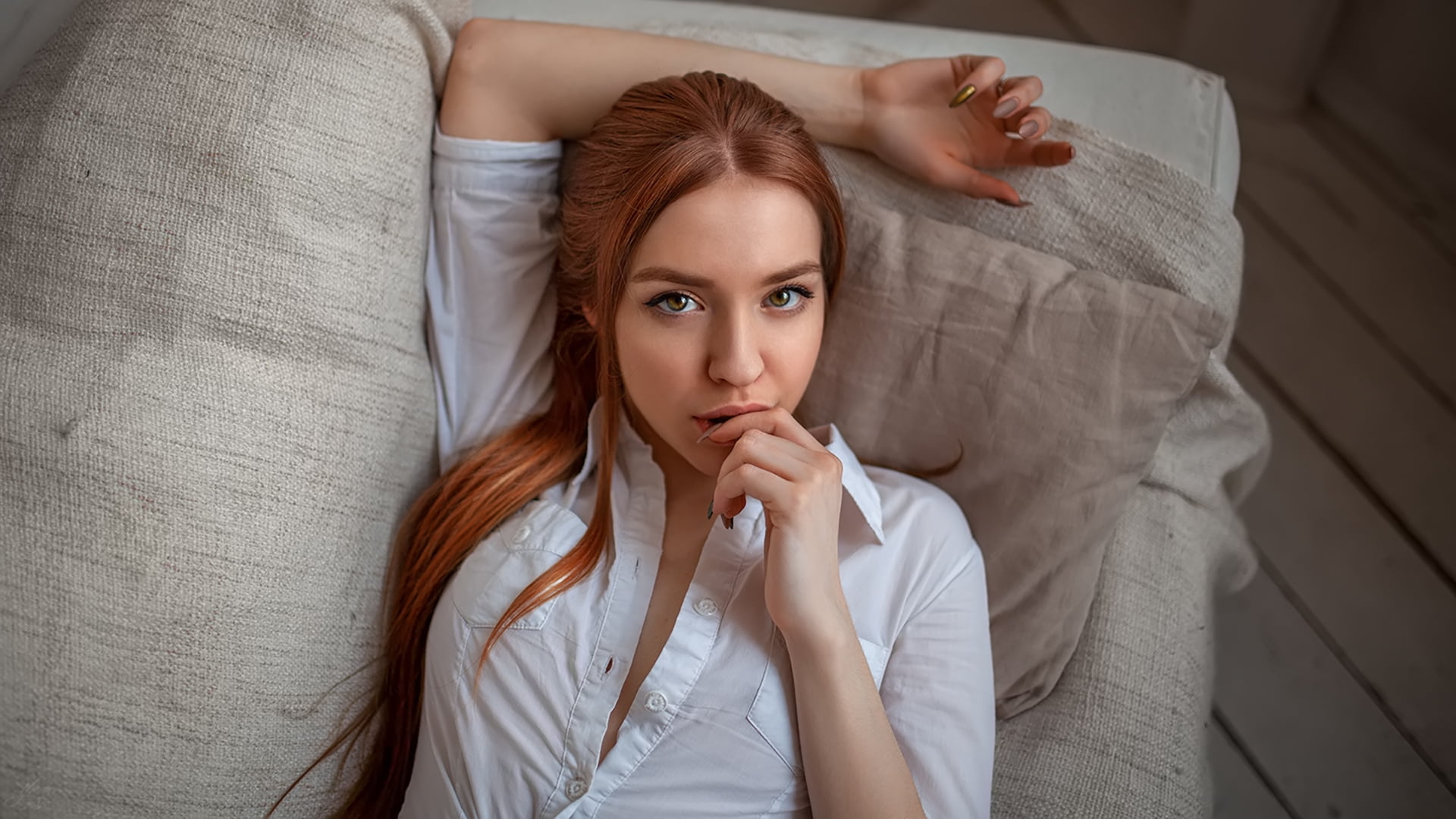 face, looking at viewer, portrait, painted nails, redhead, 1080P, women, couch, white shirt, top view, long hair, finger on lips, HD Wallpaper