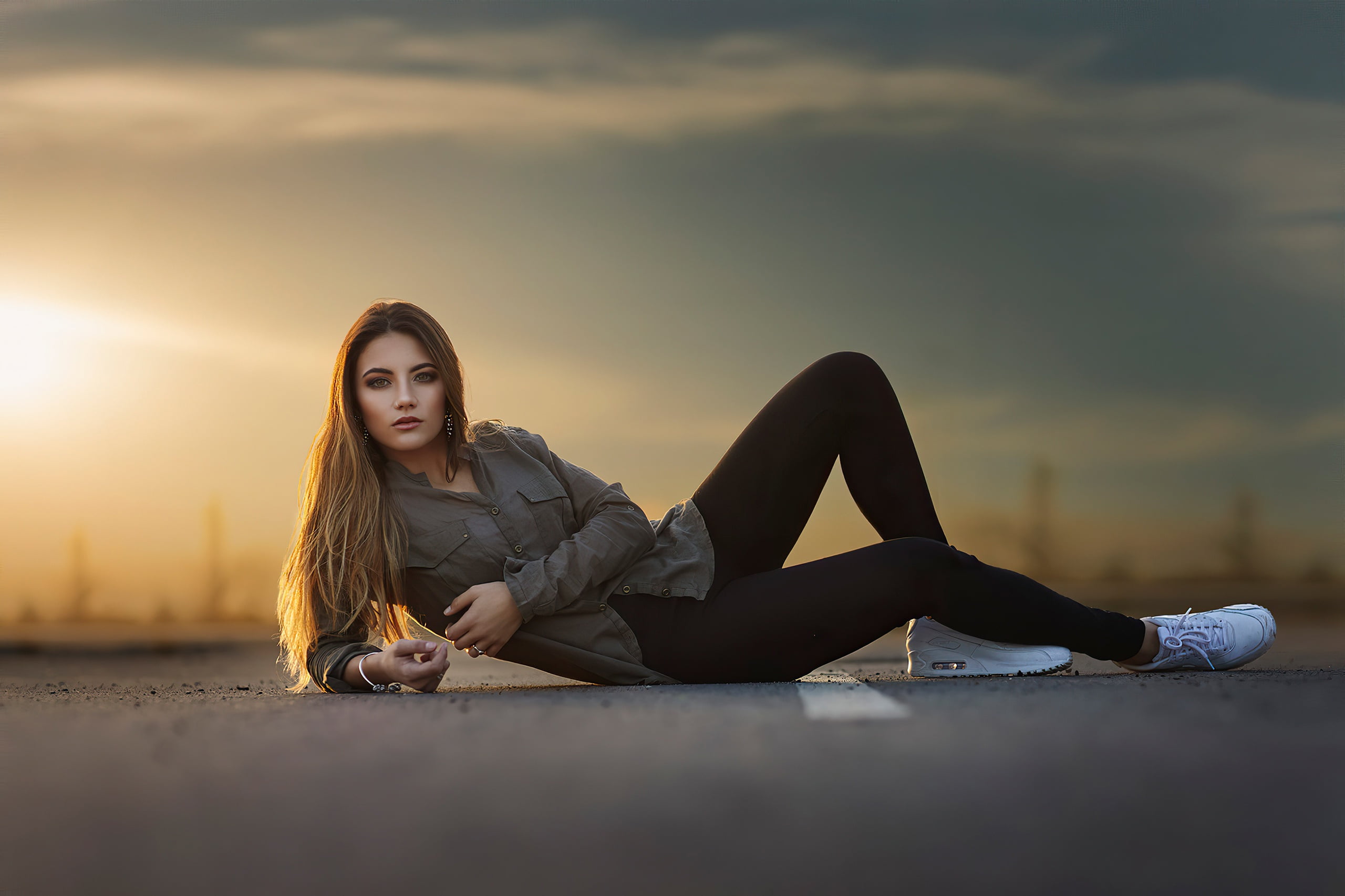 beauty, figure, pants, pose, look, on the pavement, hairstyle, brown hair, 2K, lies, portrait, the sun, makeup, bokeh, shirt, sneakers, the sky, model, HD Wallpaper