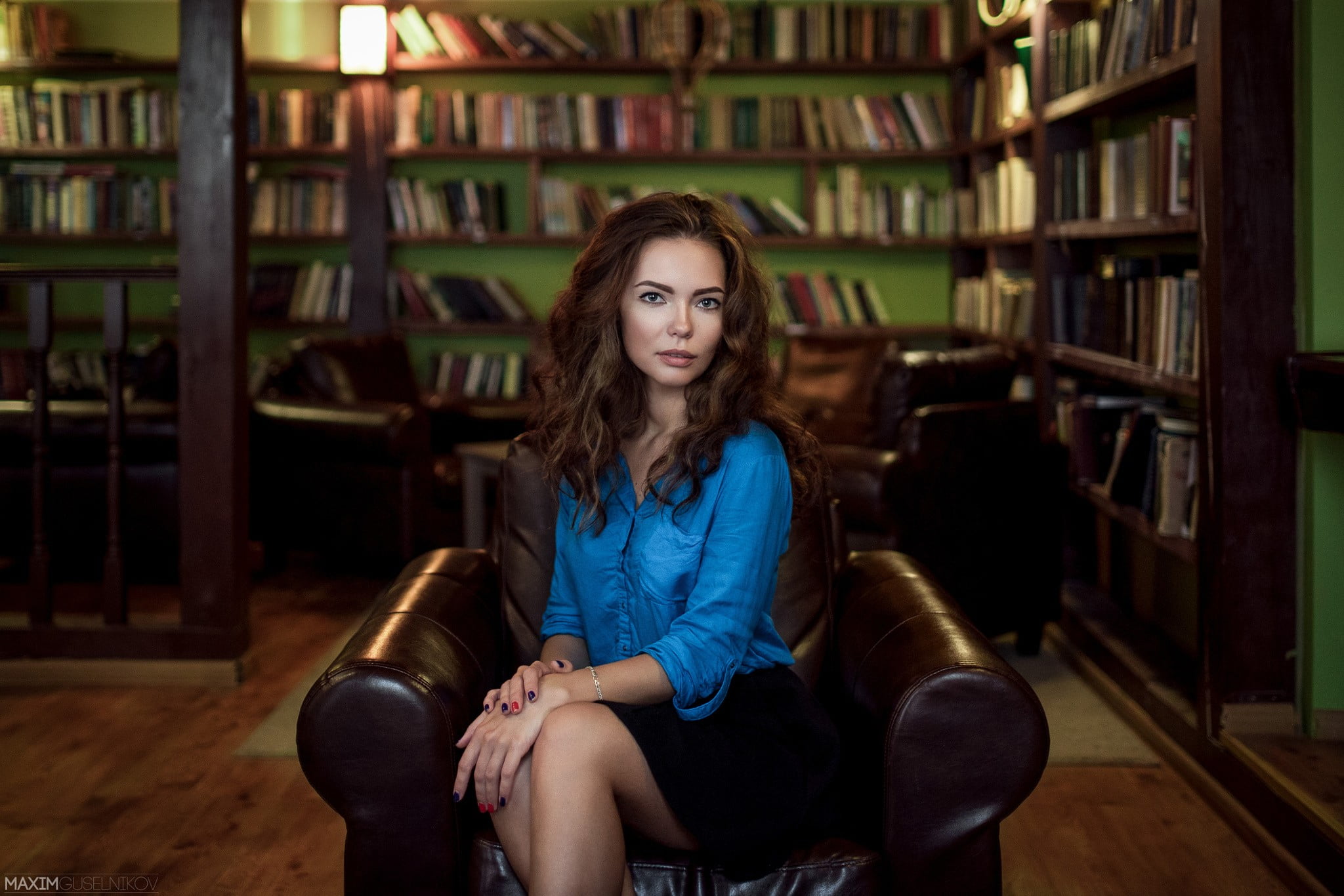 couch, armchair, beautiful woman, front view, casual clothing, 1080P, bookshelf, sitting, young adult, young women, real people, brunette, women, portrait, HD Wallpaper