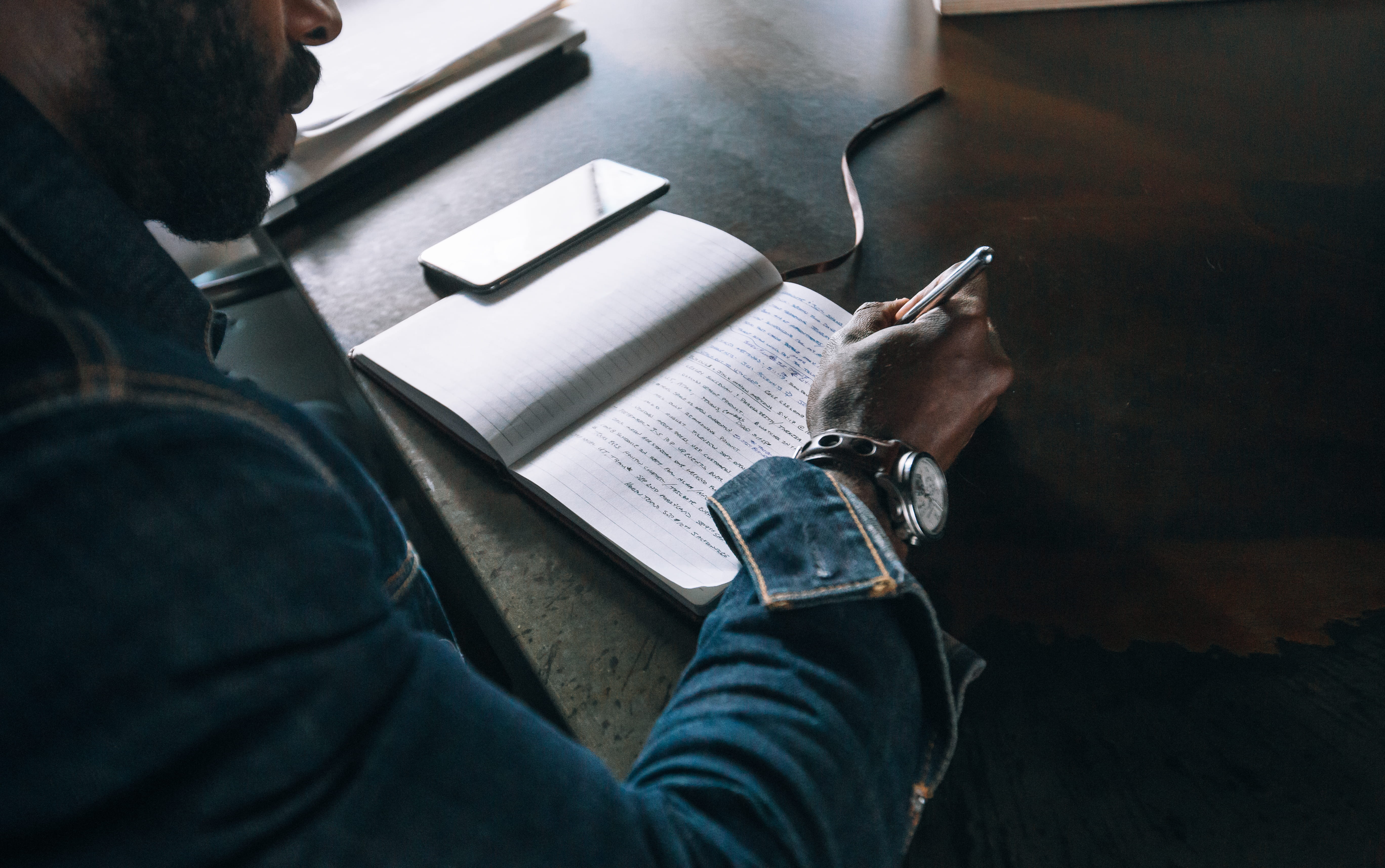 working, creative, daytime, business, male, phone, indoors, businessman, adult, notebook, home Interior, sitting, workspace, daylight, pen, writing, document, HD Wallpaper