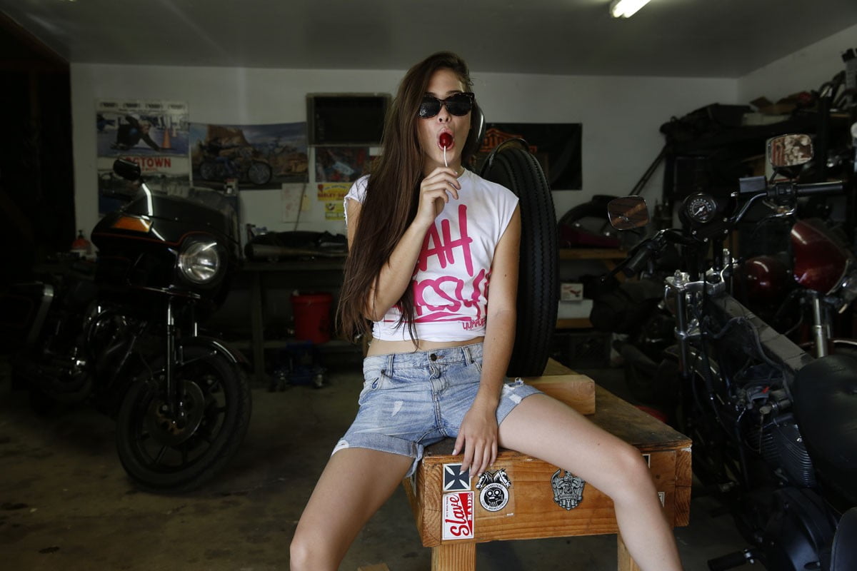 casual clothing, motorcycle, long hair, hair, young women, one person, brunette, standing, indoors, real people, white tops, mouth open, lifestyles, leisure activity, HD Wallpaper