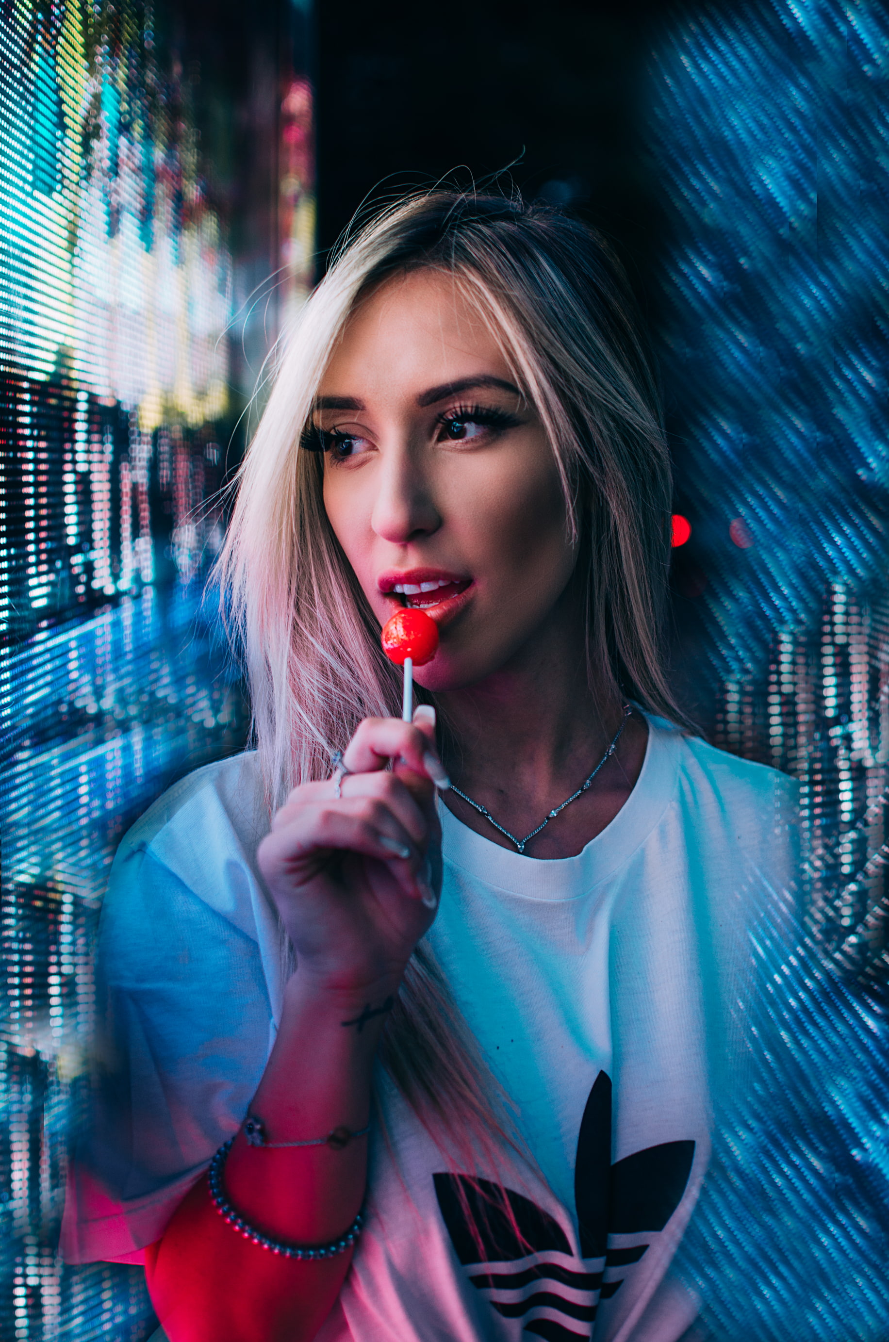 adult, portrait, lipstick, face, human lips, women, nightlife, beautiful woman, black background, holding, blonde, one person, make-up, sweets, beautiful people, Phone HD Wallpaper
