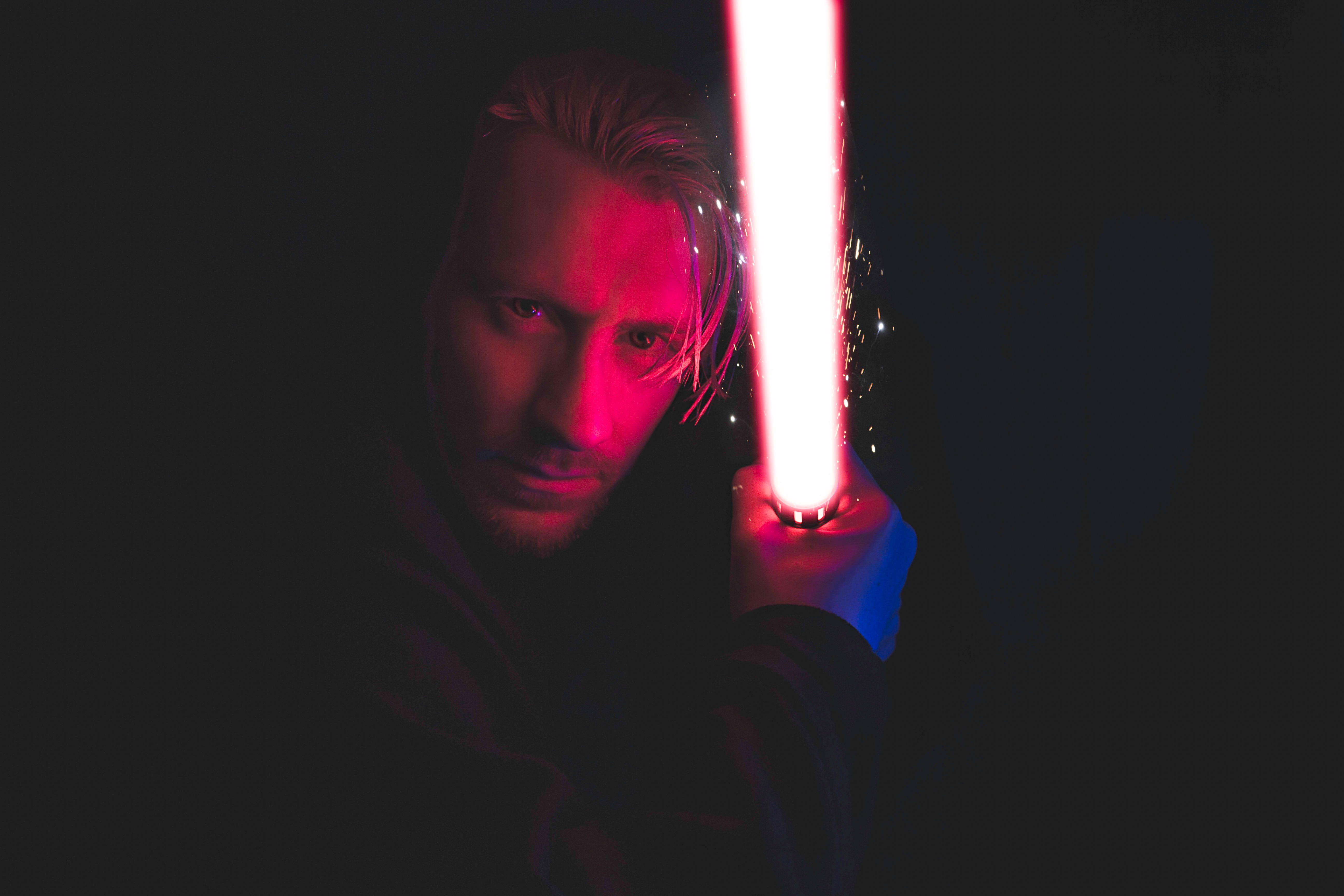 male, young men, ominous, illuminated, one person, portrait, knife - weapon, pink, red, lightsaber, sign, men, 5K, person, looking at camera, social issues, HD Wallpaper