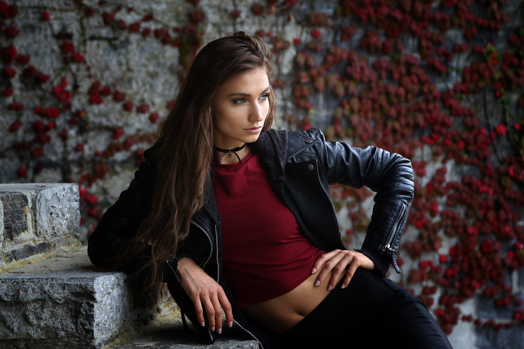 1080P, choker, tanned, wall, brick, hair, three quarter length, sitting, young adult, front view, brown hair, looking away, hairstyle, long hair, leather jackets, HD Wallpaper