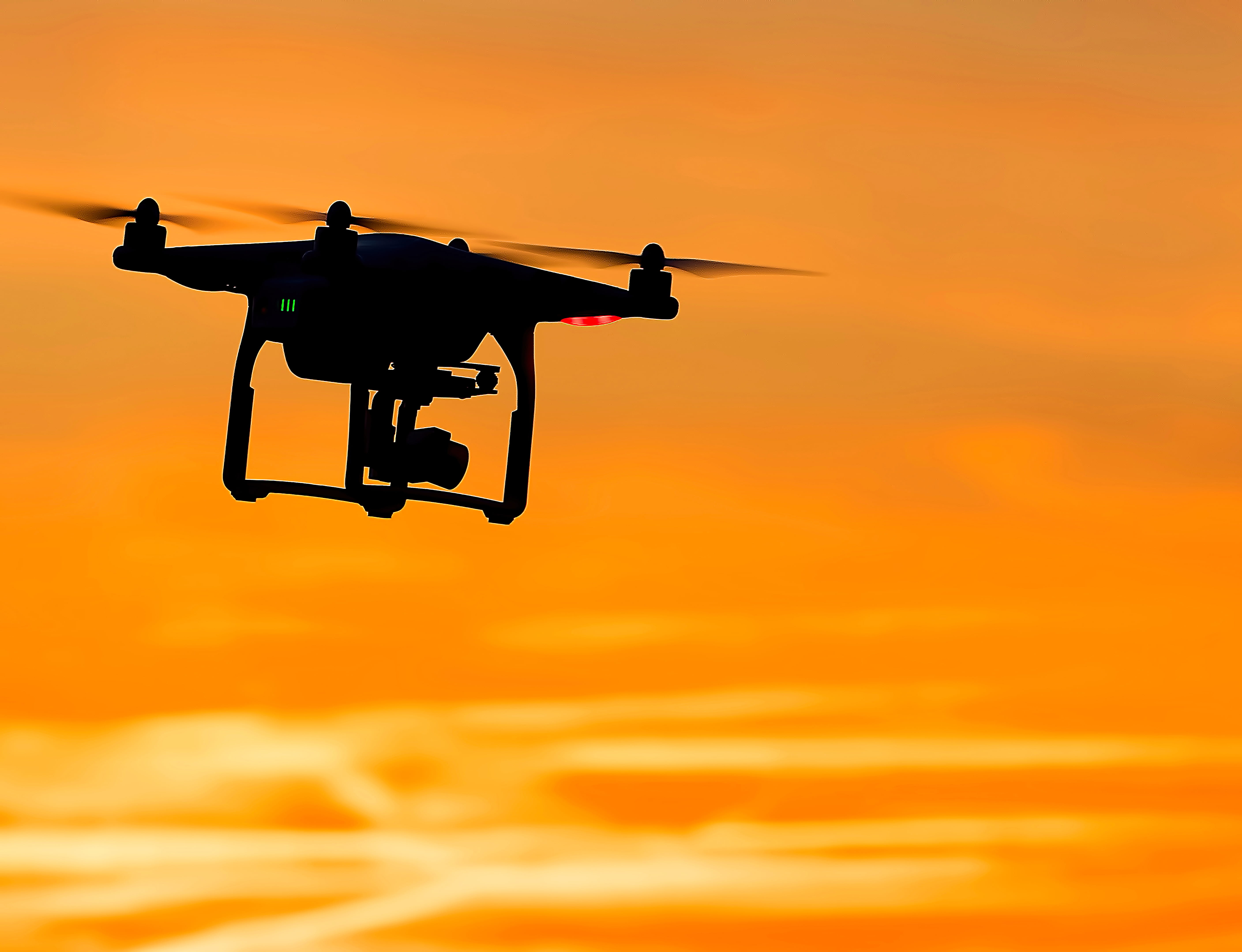 camera - photographic equipment, sunset, motion, flying, hovering, quadcopter, on the move, orange, yellow, single object, sky, copter, aerospace industry, HD Wallpaper