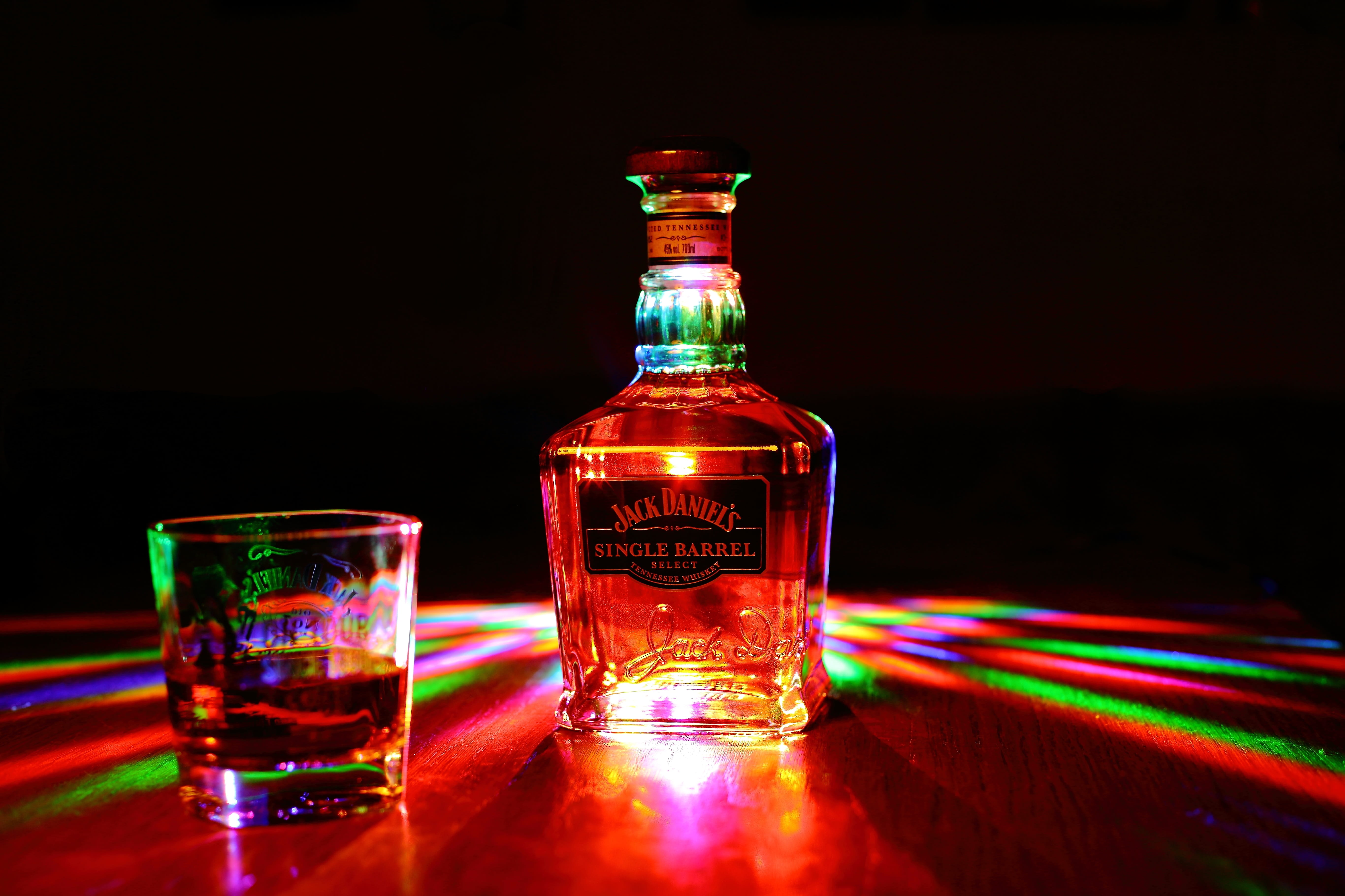 drink, Daniels, alcohol sales, Jack Daniels, bottle, transparent, alcohol, whisky, table, daniels, reflection, Jack, indoors, glass - material, jack, multi colored, HD Wallpaper