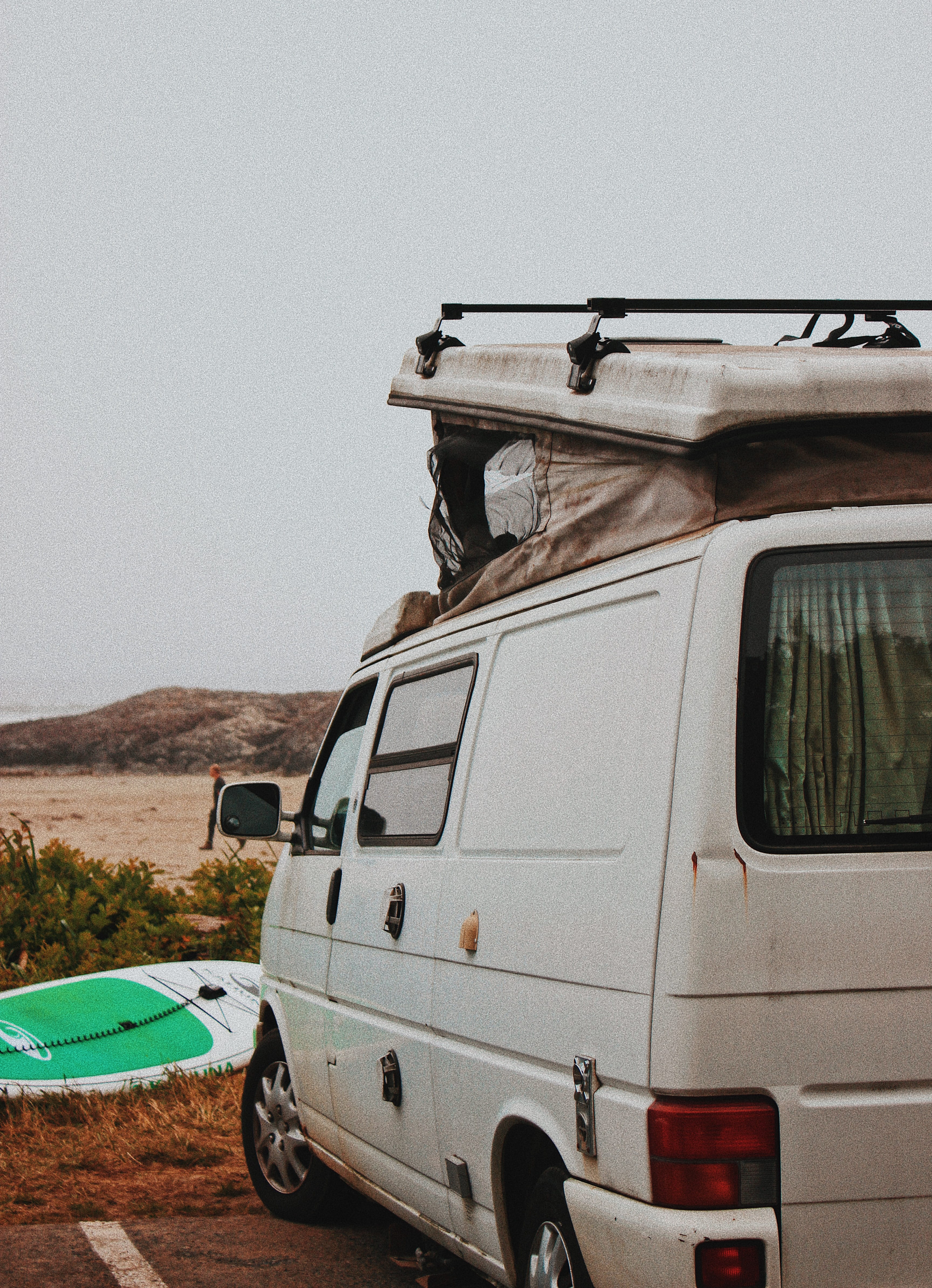 car, gun, outdoors, caravan, wheel, day, tofino, stationary, abandoned, tire, west coast, old, long beach, off-road vehicle, clear sky, sky, van, white, Phone HD Wallpaper