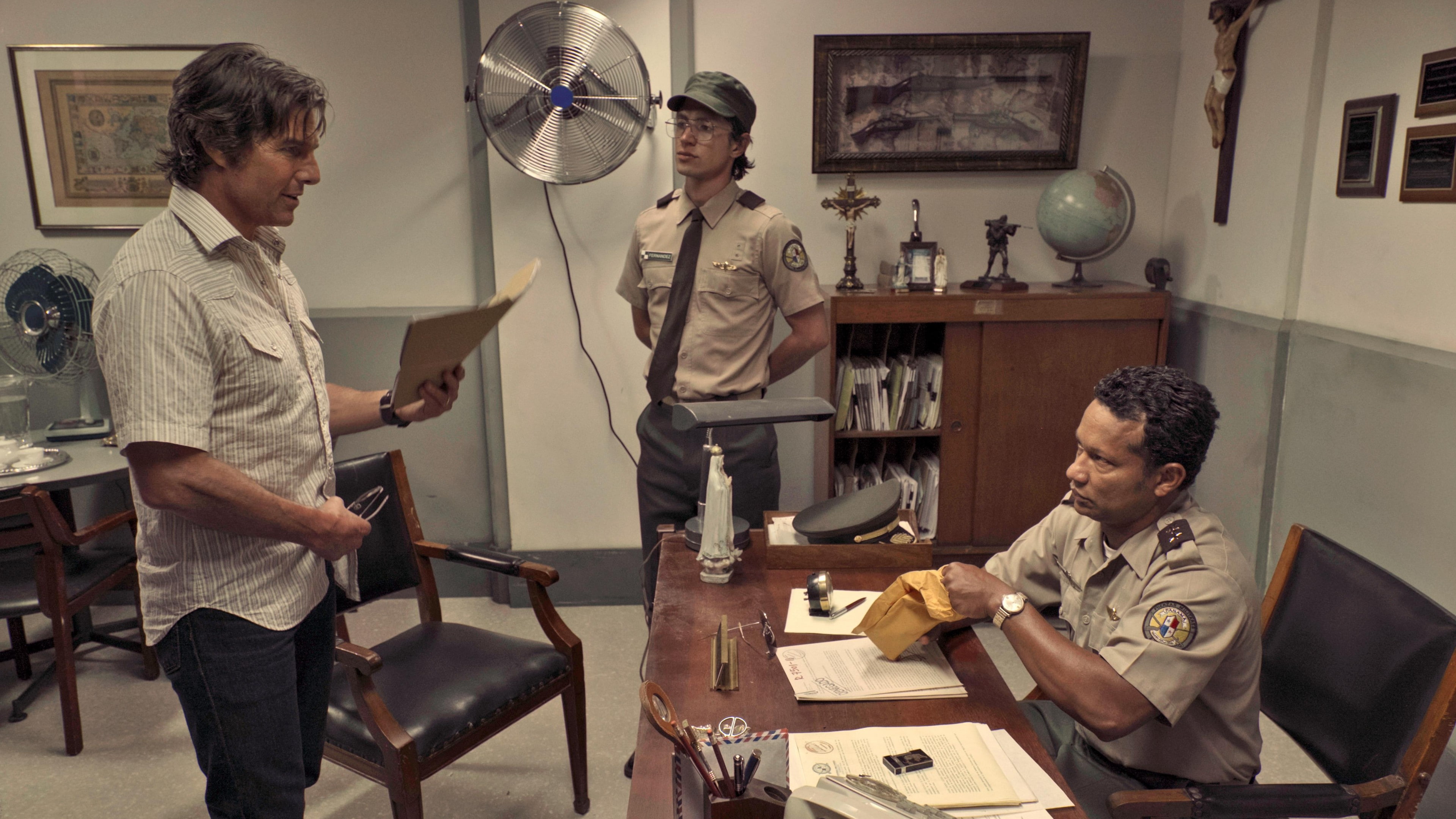 brown, beside, officer, front, American Made, 4k, police, sitting, button, desk, white, documents, shirt, man, wooden, Tom Cruise, 4K, holding, HD Wallpaper