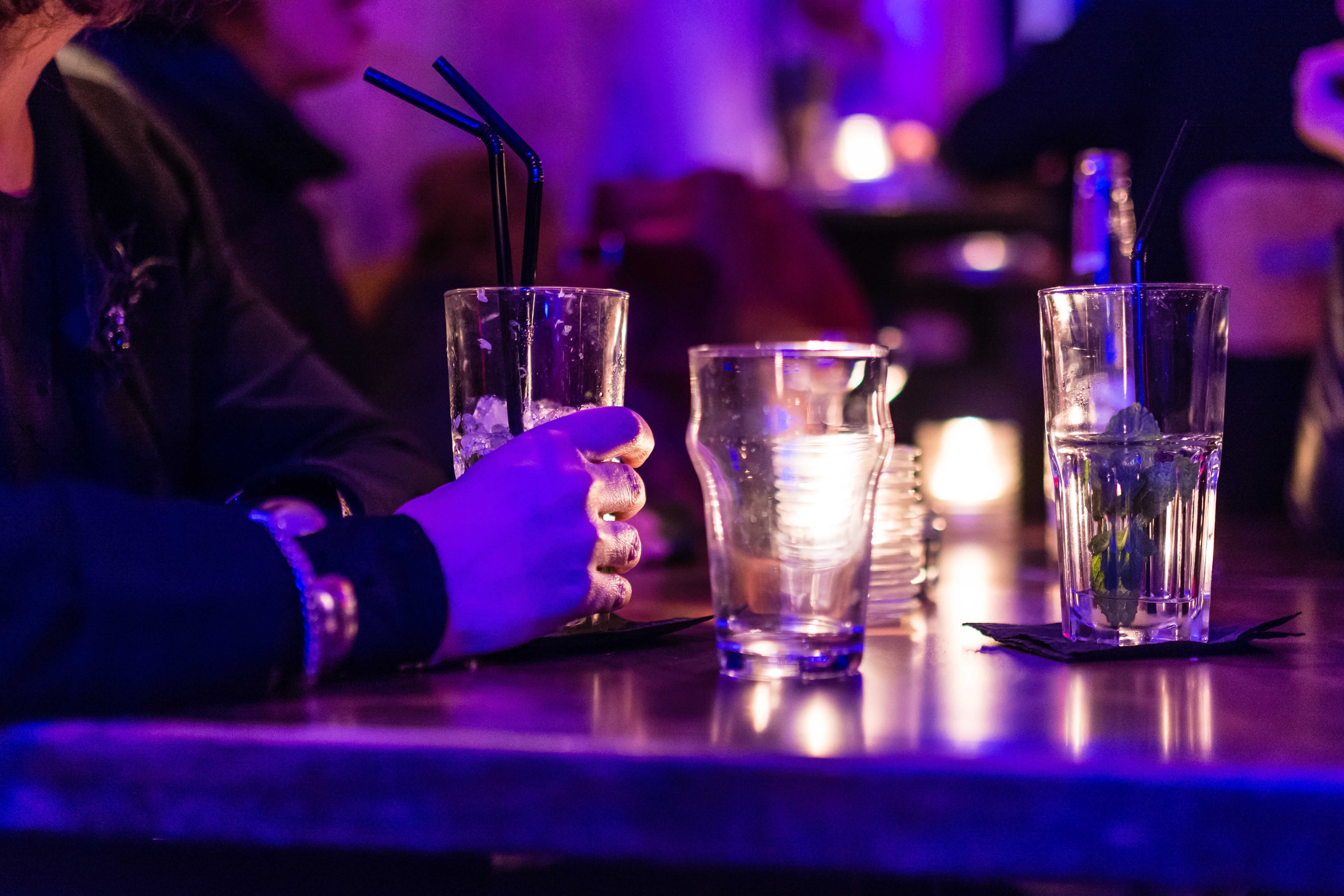 cocktail, drinking glass, bar, person, food and drink, 5K, table, straw, drinking, glass, black, shot glass, refreshment, one person, focus on foreground, HD Wallpaper
