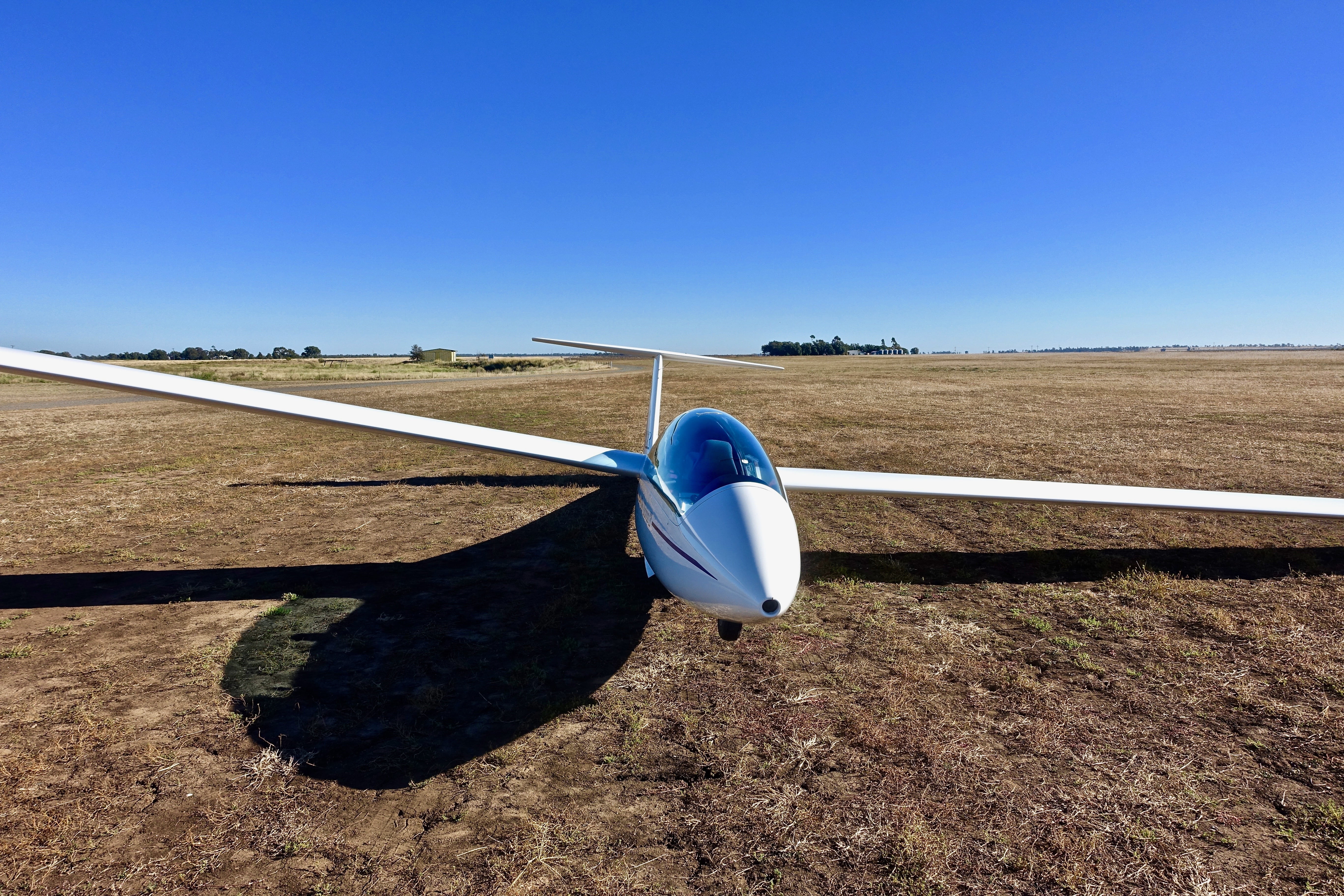 land, speed, air Vehicle, leisure, landscape, dom, flying, blue, 5K, airplane, field, aircraft, day, nature, sky, sunny, shadow, environment, copy space, HD Wallpaper