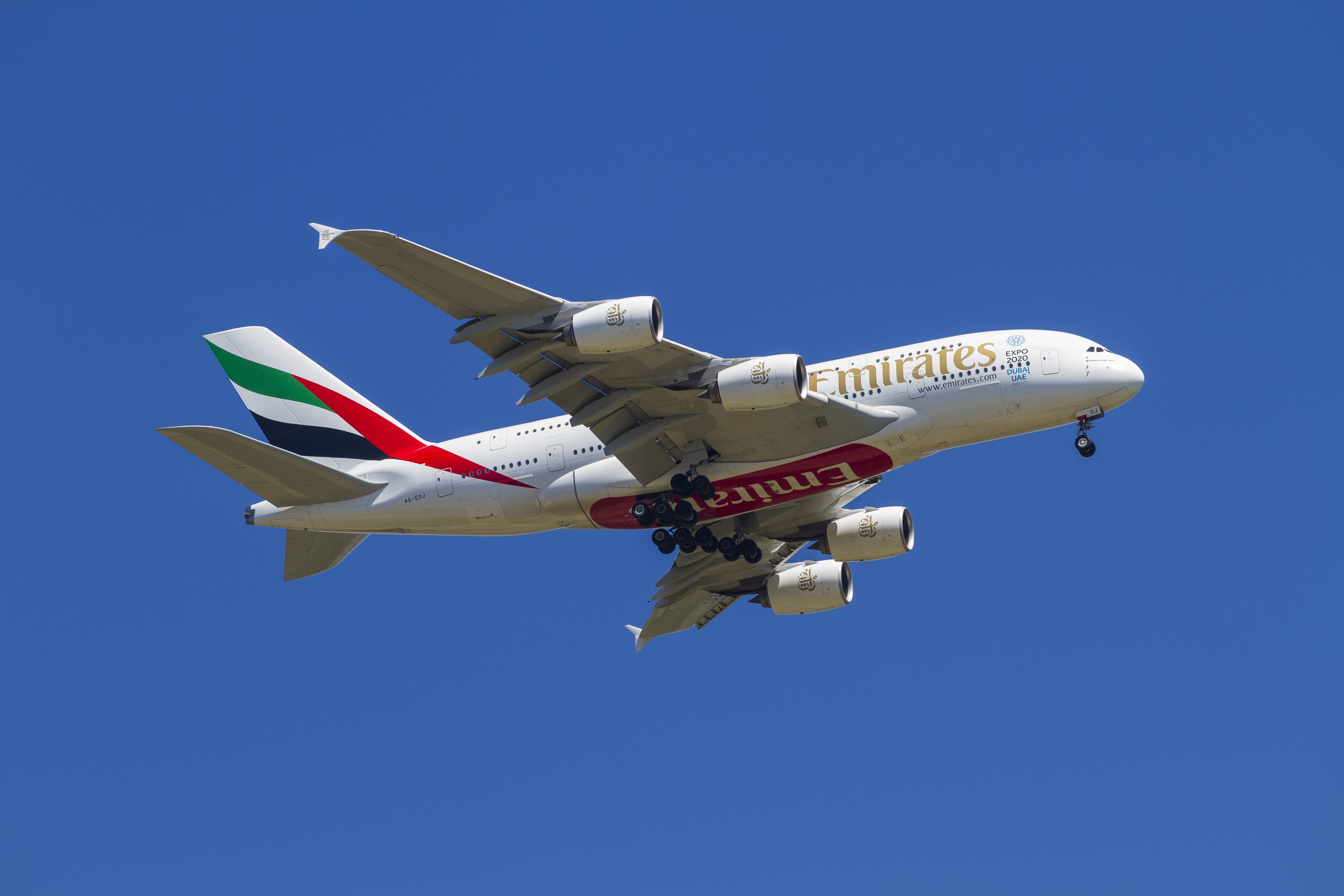 airplane, no people, nature, single object, landing, sky, air vehicle, sunny, fly, above, plane, blue, emirates, mode of transportation, clear sky, on the move, HD Wallpaper