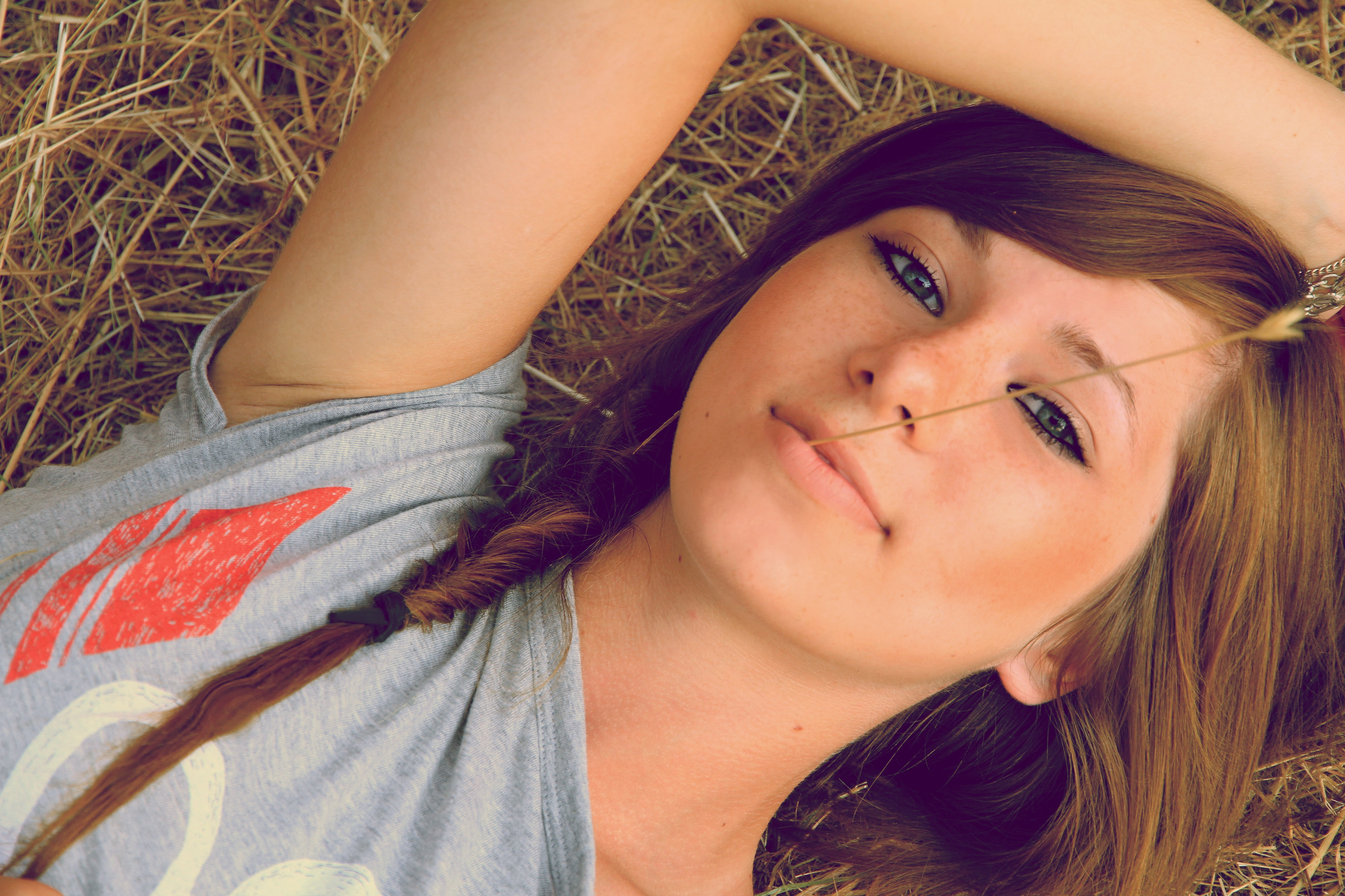 smiling, hands on head, face, portrait, braids, model, looking at viewer, women outdoors, nature, brunette, women, spikelets, freckles, lying on back, long hair, HD Wallpaper