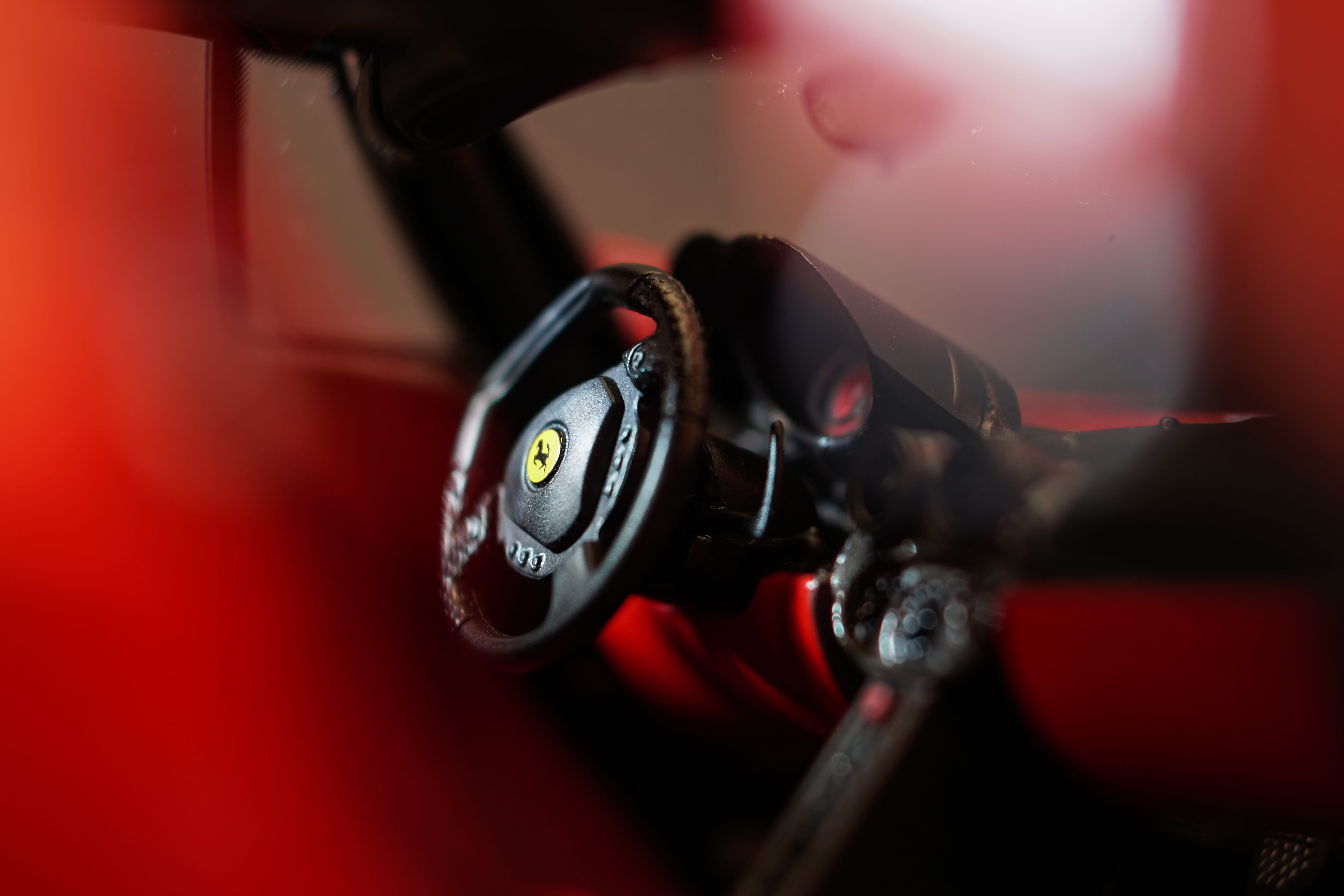 sports car, handlebar, transportation, background, car interior, motor vehicle, bokeh, dash, ferrari, interior, focus, wheel, car background, italian, 5K, HD Wallpaper