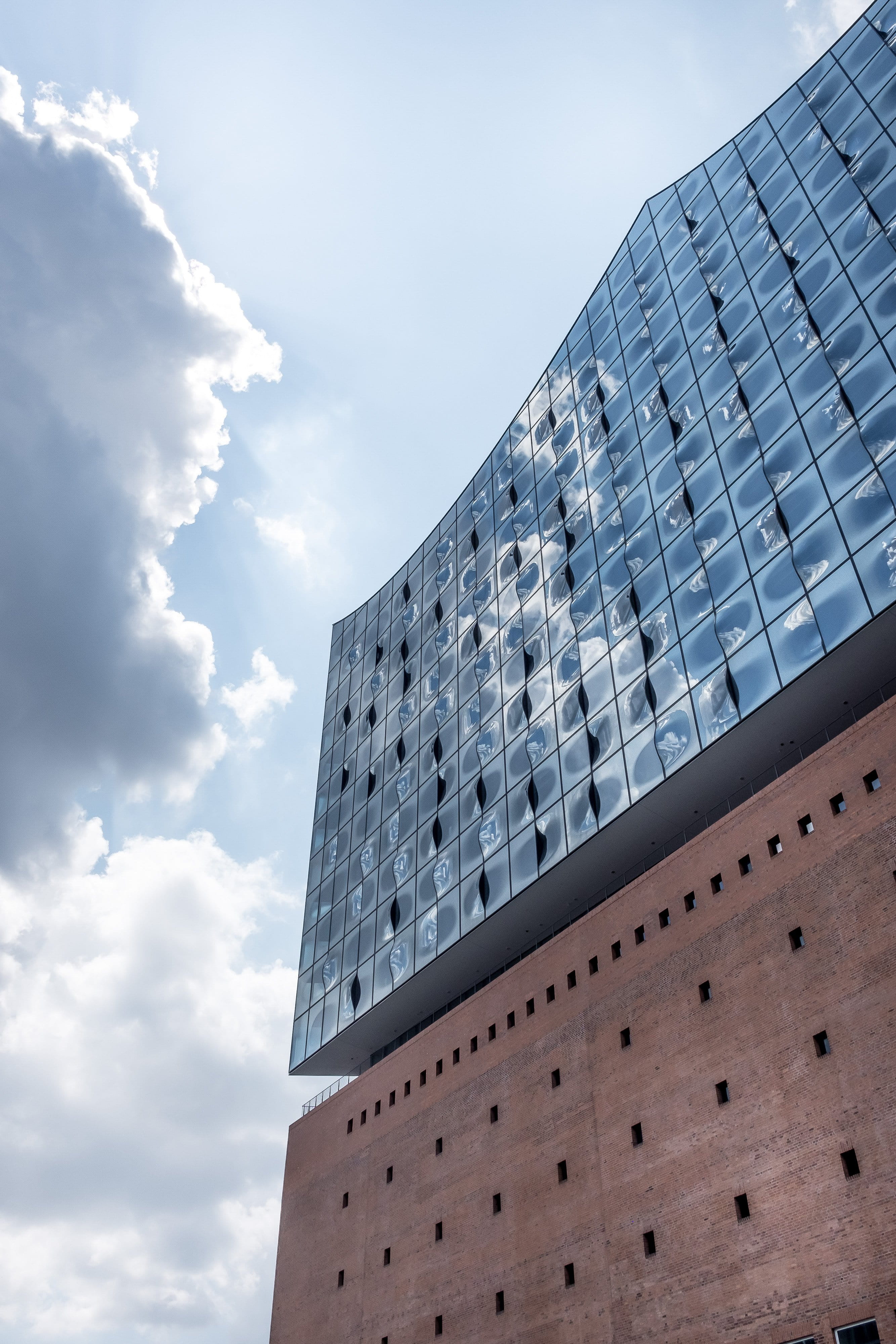 concert, facade, building, office, architecture, hafen, cloud - sky, window, exterior, sky, river, built structure, landmark, outdoors, sunlight, music, Phone HD Wallpaper