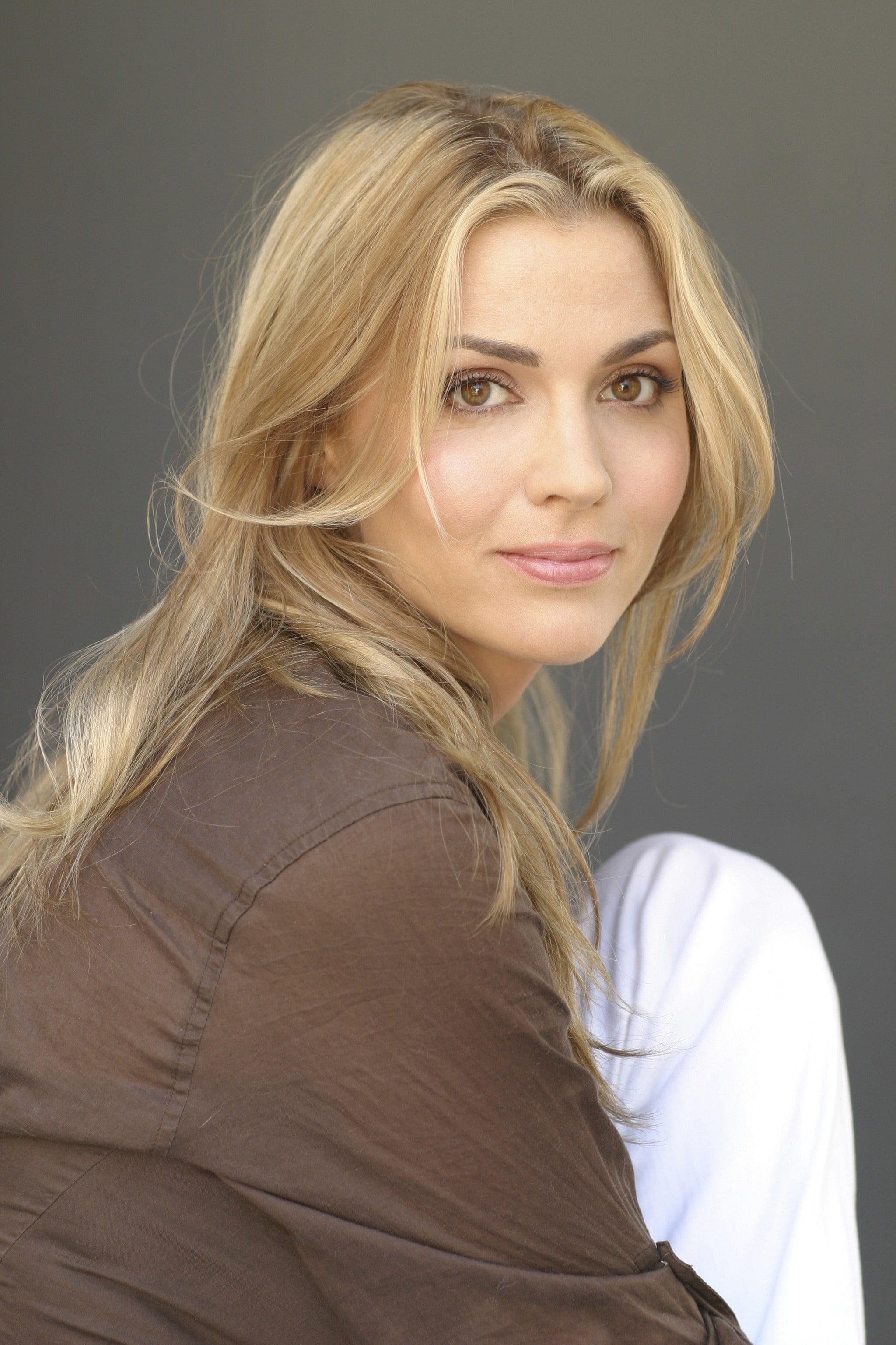 looking at camera, headshot, blond hair, gray background, hairstyle, hair, one person, portrait, 2K, gray, human hair, indoors, beauty, smiling, portrait display, Phone HD Wallpaper