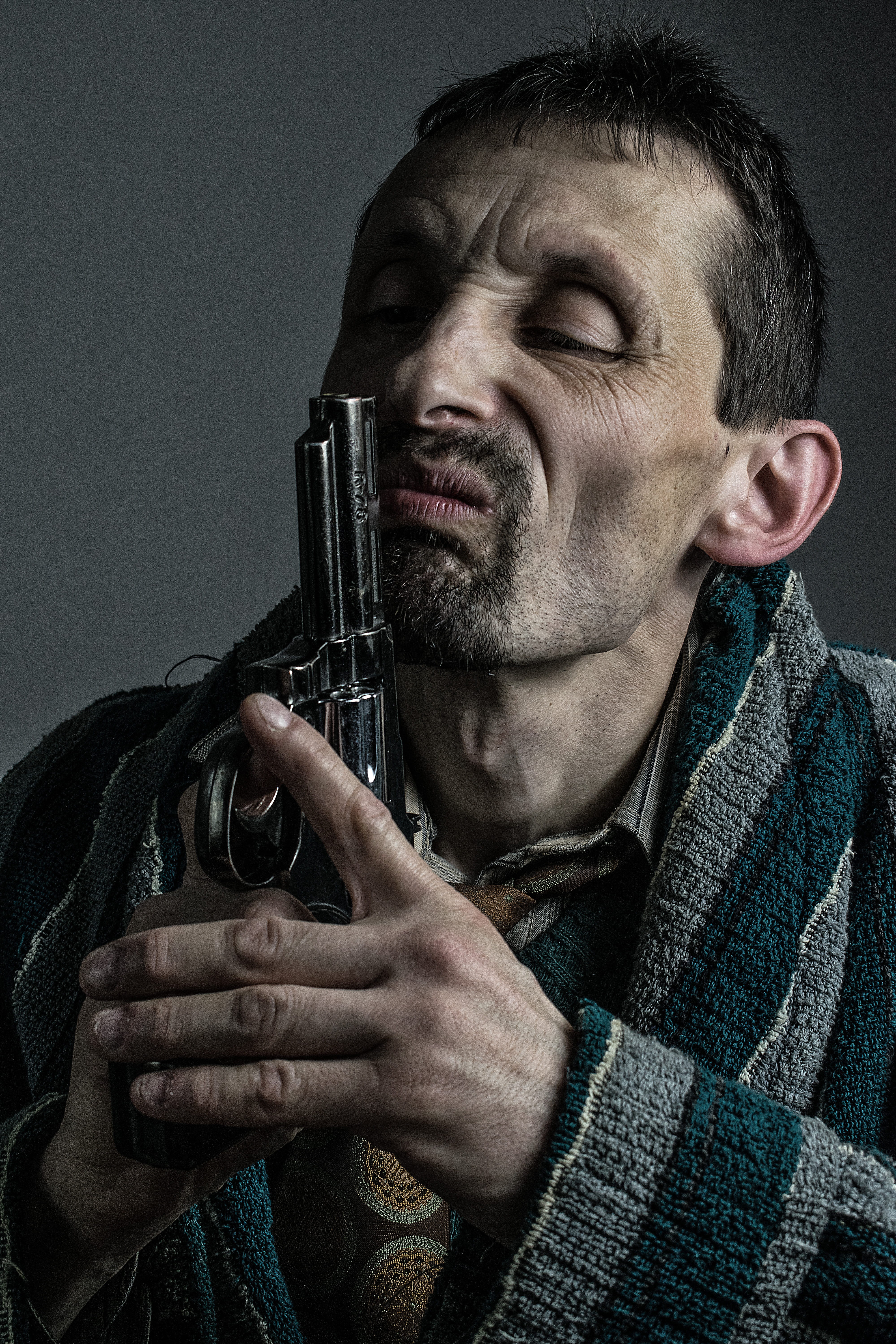 holding, men, watch, warm clothing, grotesque, studio shot, eyes closed, indoors, clothing, beard, people grimace, people, one person, young adult, pistol, Phone HD Wallpaper