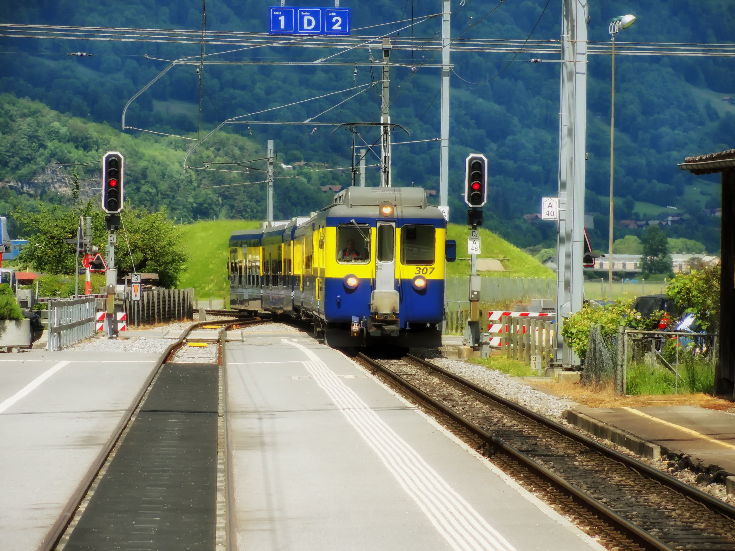 railroad track, land vehicle, sign, motion, station, train, nature, switzerland, electricity, transportation, passenger train, travel, tracks, train - vehicle, HD Wallpaper