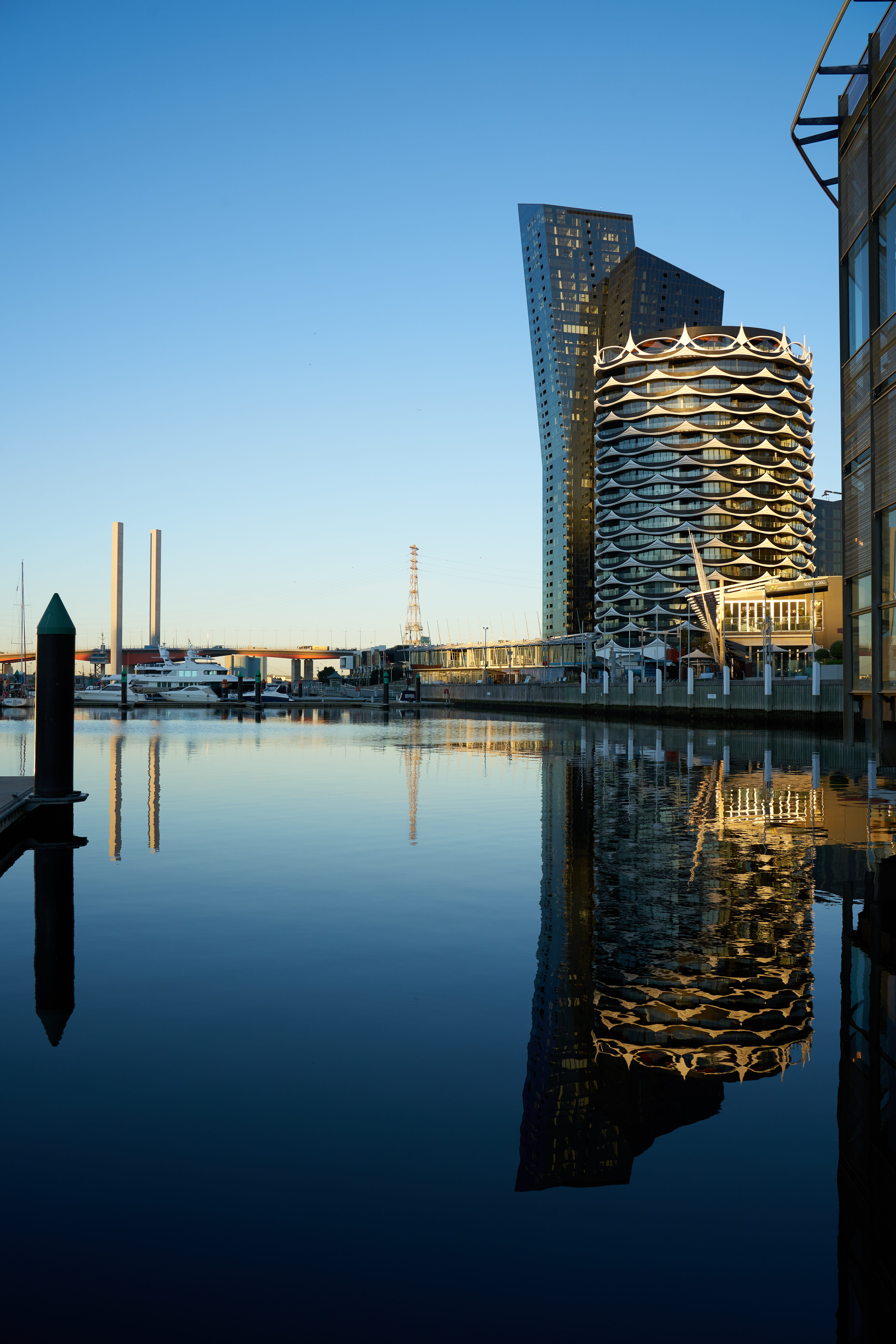 architecture, tower, symmetrical, 8K, outdoors, waterfront, city, building, skyscraper, lake, financial district, blue, photography, nature, built structure, Phone HD Wallpaper