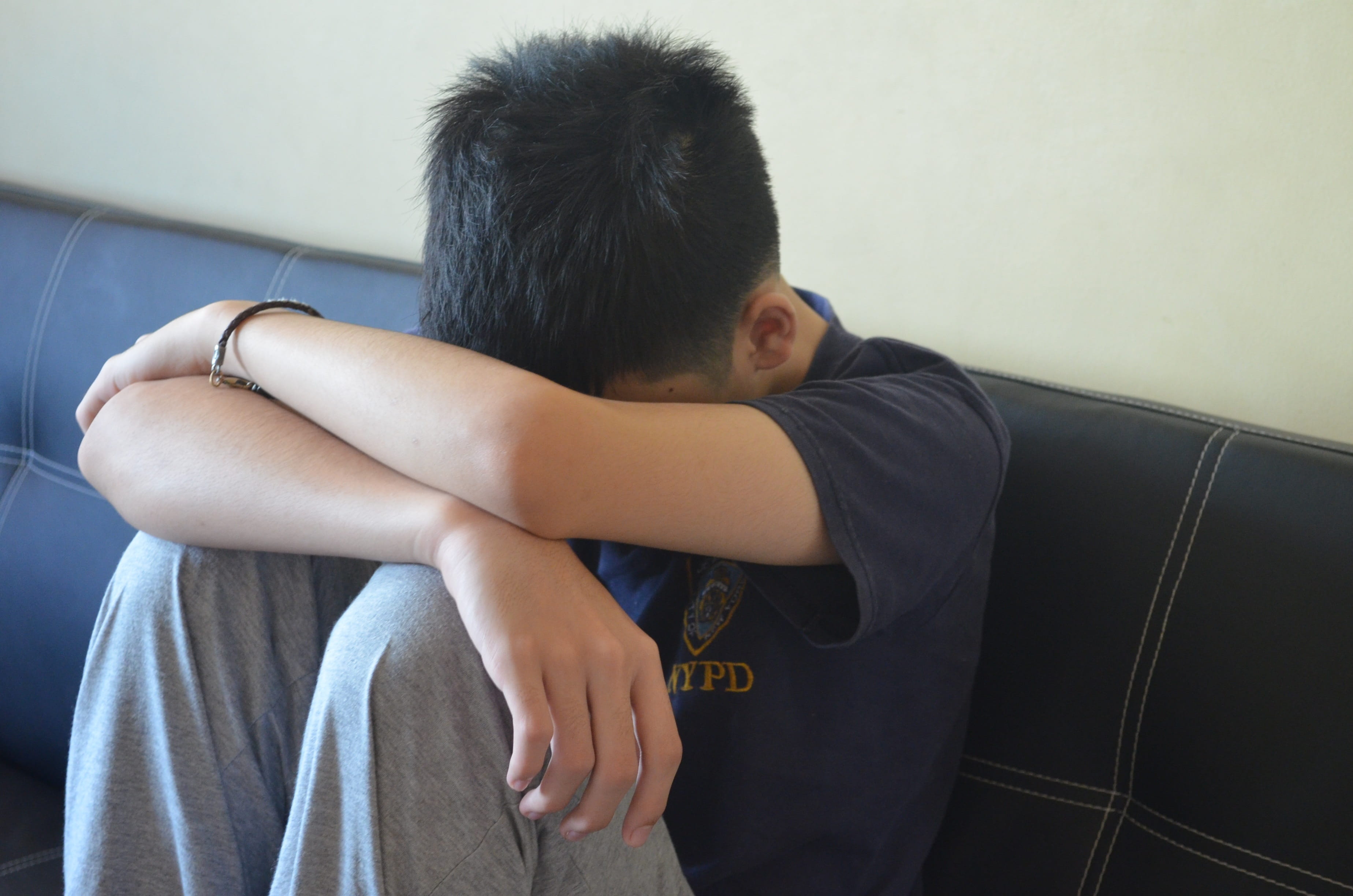 teenage boys, sadness, home interior, furniture, men, person, 2K, leisure activity, boy, black shirt, one person, black, young men, loneliness, sweatpants, HD Wallpaper