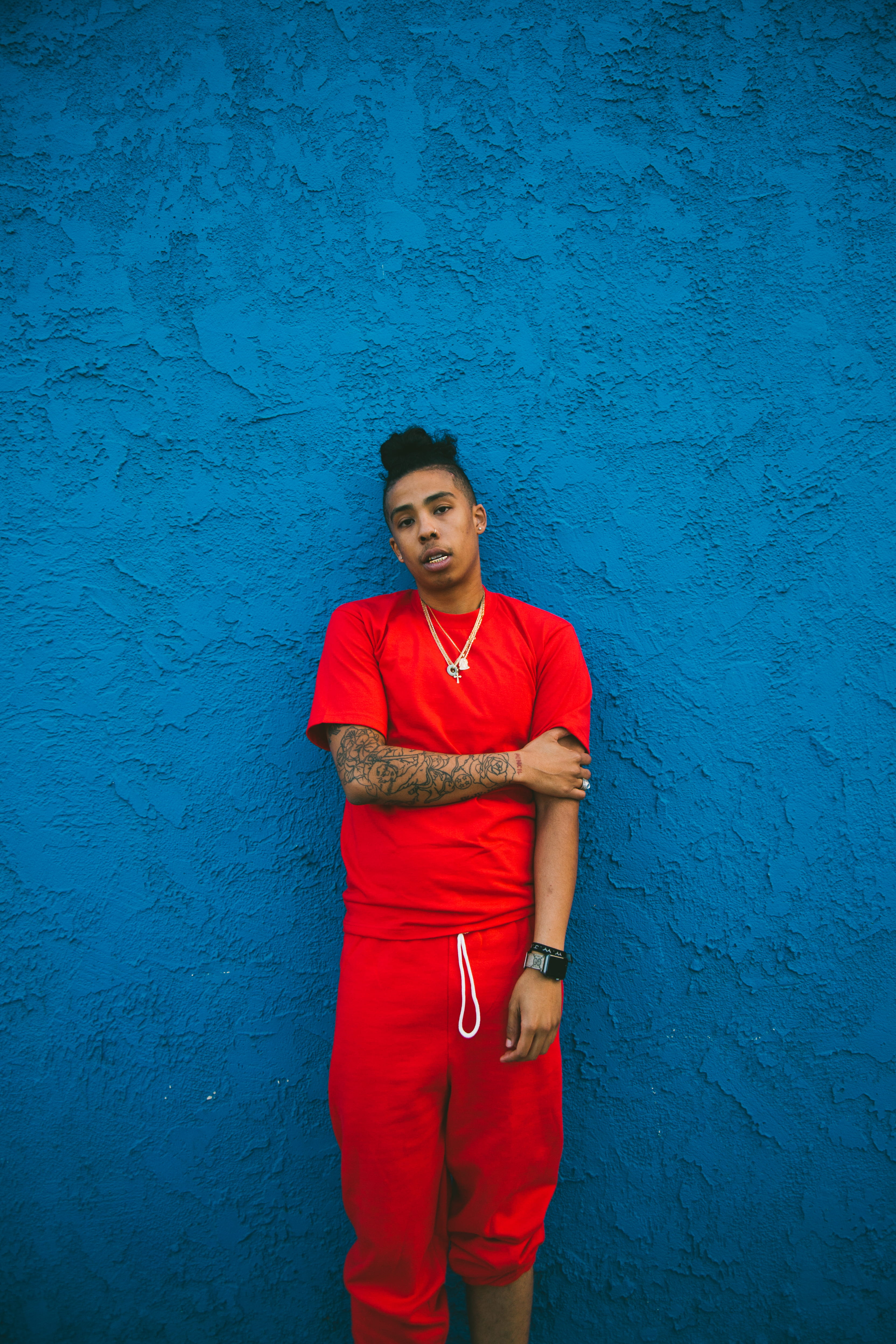 standing, blue, portrait, wall art, t, real people, african american, sweatpants, front view, contemplation, young men, wall - building feature, man, wearing, Phone HD Wallpaper